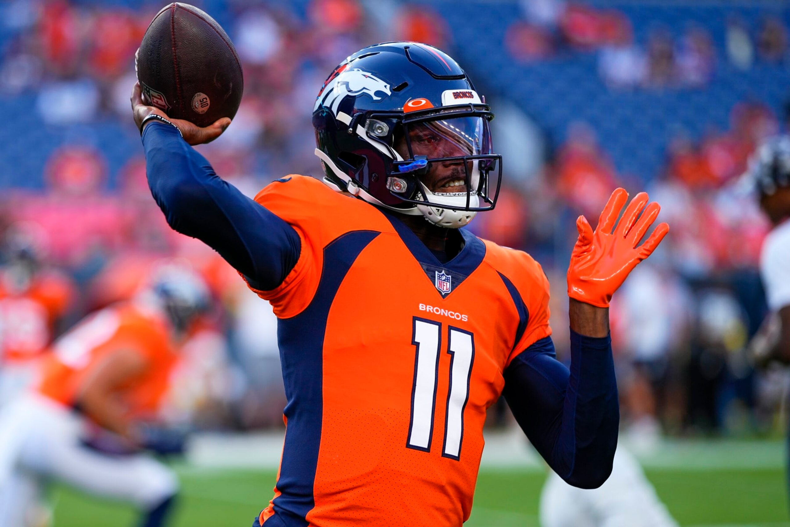 Denver Broncos quarterback Josh Johnson (11) warms up against the Minnesota Vikings during an NFL preseason football game, Saturday, Aug. 27, 2022, in Denver. (AP Photo/Jack Dempsey)