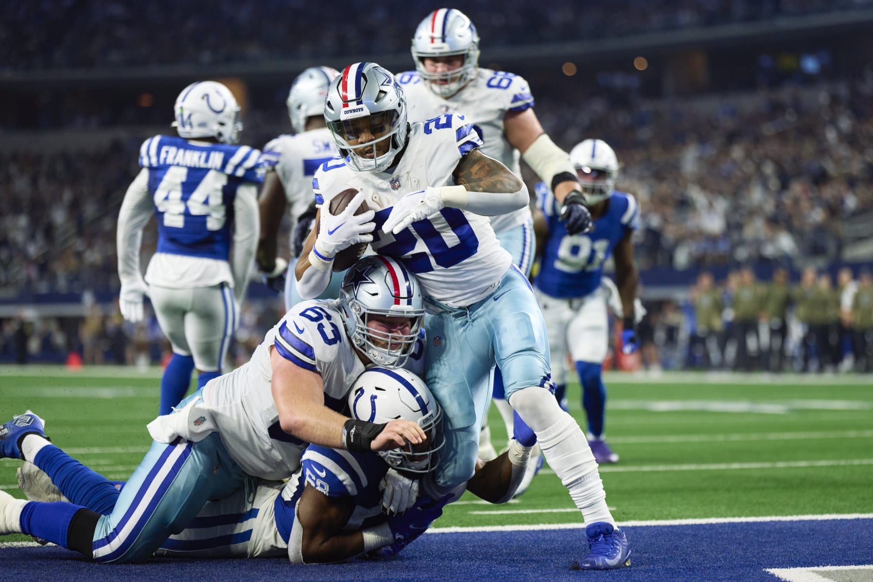 ARLINGTON, TX - DECEMBER 04: Tony Pollard #20 of the Dallas Cowboys scores a touchdown against the Indianapolis Colts during the first half at AT&T Stadium on December 4, 2022 in Arlington, Texas. (Photo by Cooper Neill/Getty Images)