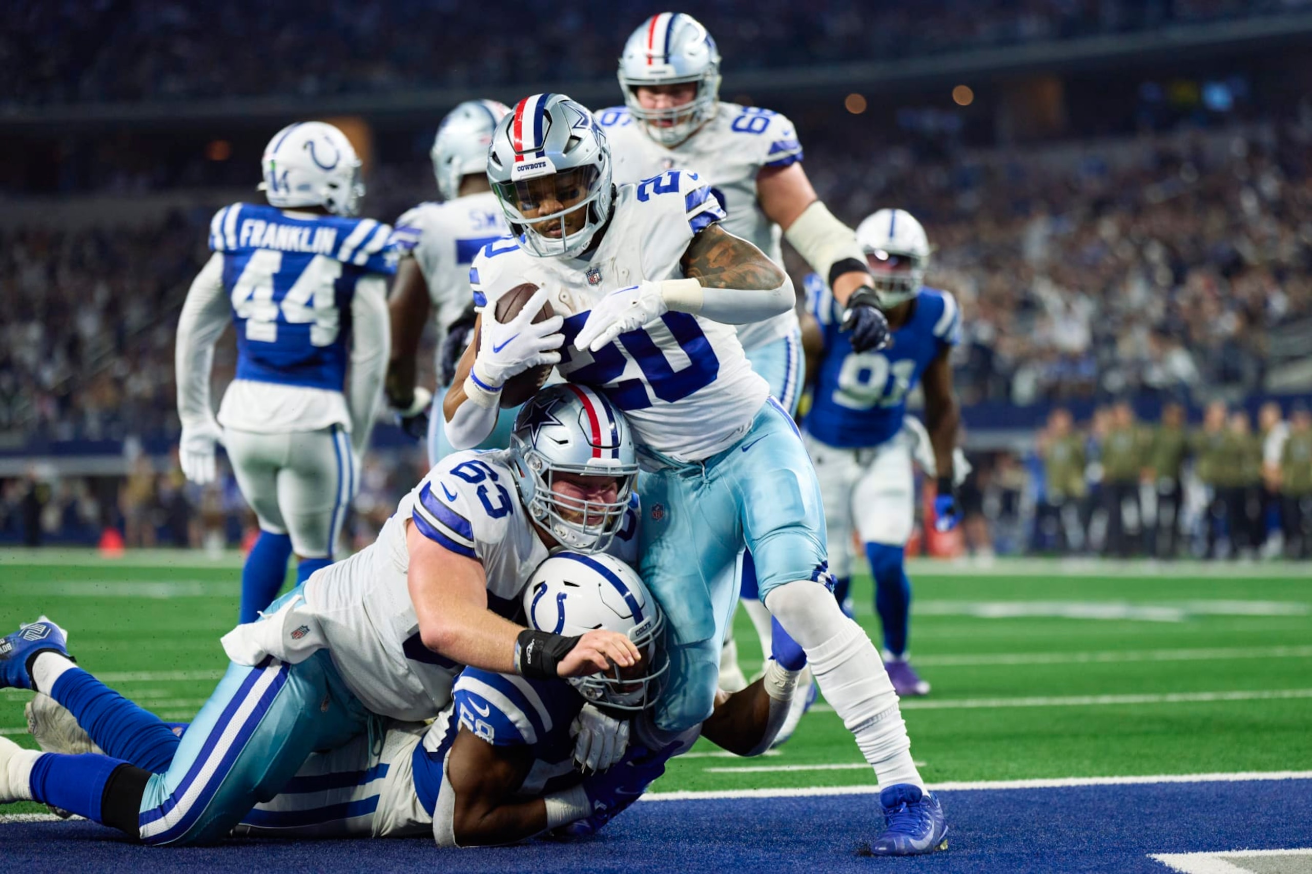 ARLINGTON, TX - DECEMBER 04: Tony Pollard #20 of the Dallas Cowboys scores a touchdown against the Indianapolis Colts during the first half at AT&T Stadium on December 4, 2022 in Arlington, Texas. (Photo by Cooper Neill/Getty Images)