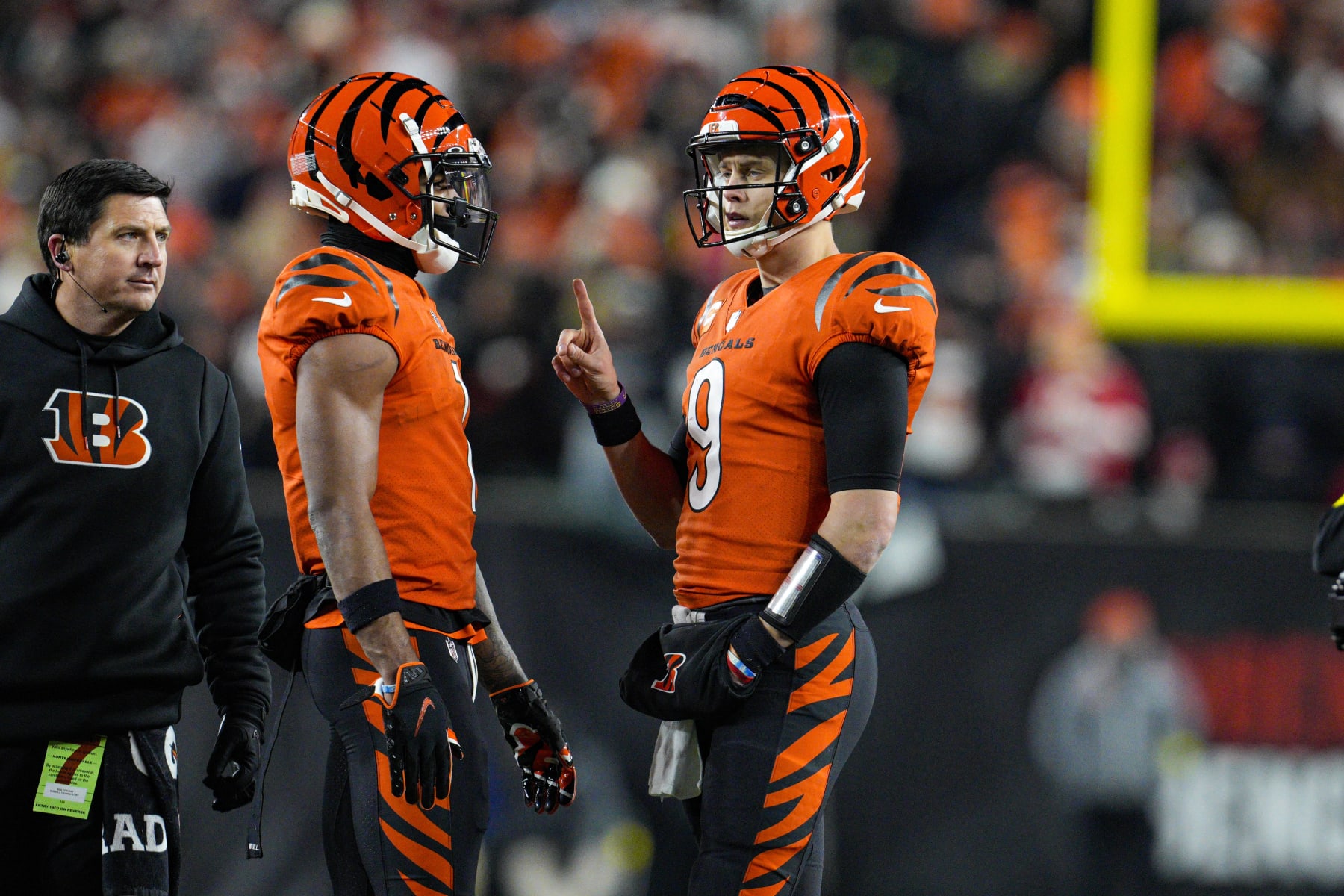 Cincinnati Bengals quarterback Joe Burrow (9) talks with wide receiver Ja'Marr Chase (1) in the second half of an NFL football game against the Kansas City Chiefs in Cincinnati, Fla., Sunday, Dec. 4, 2022. The Bengals defeated the Chief 27-24. (AP Photo/Jeff Dean)
