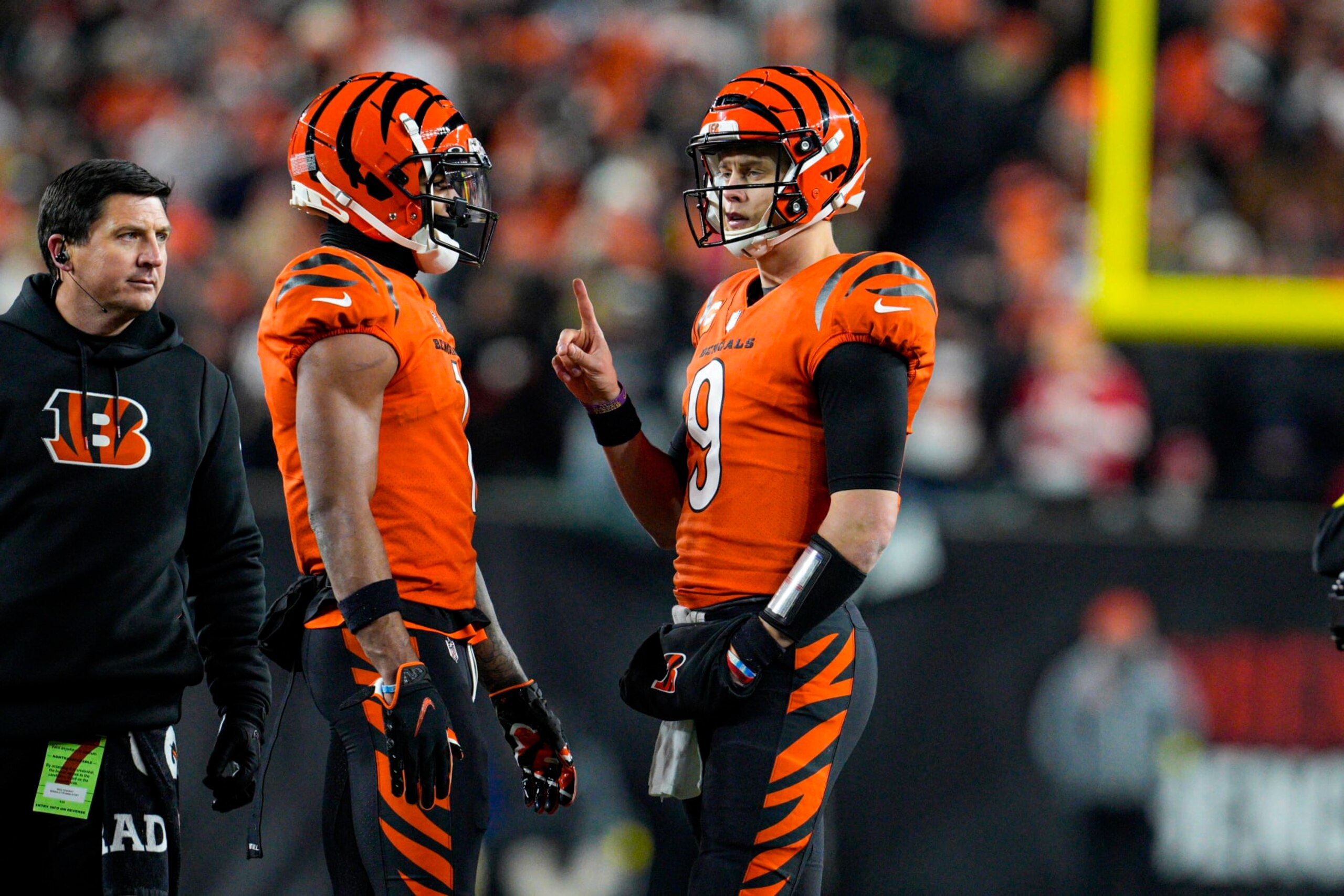 Cincinnati Bengals quarterback Joe Burrow (9) talks with wide receiver Ja'Marr Chase (1) in the second half of an NFL football game against the Kansas City Chiefs in Cincinnati, Fla., Sunday, Dec. 4, 2022. The Bengals defeated the Chief 27-24. (AP Photo/Jeff Dean)