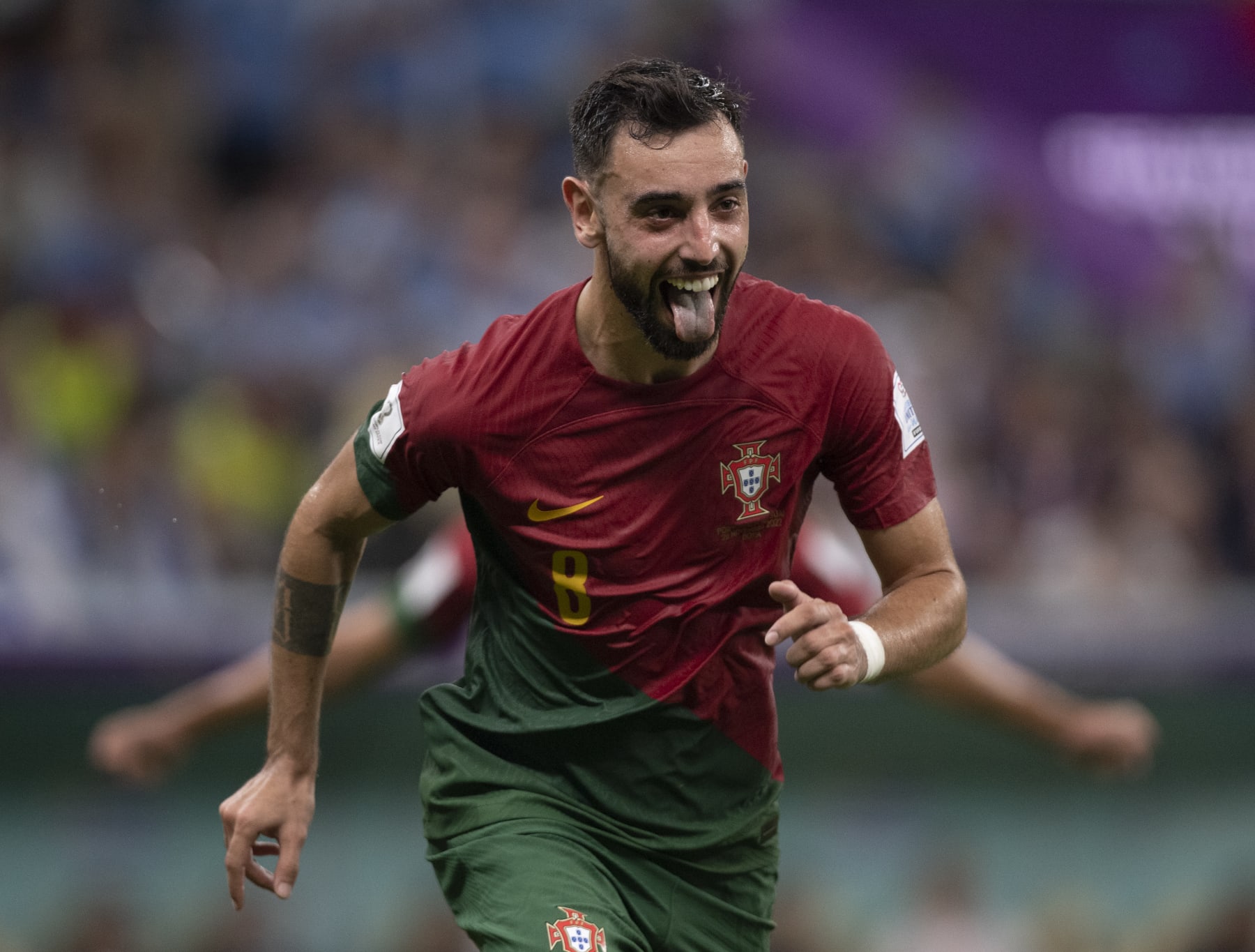 LUSAIL CITY, QATAR - NOVEMBER 28: Bruno Fernandes of Portugal celebrates scoring his second goal from the penalty spot during the FIFA World Cup Qatar 2022 Group H match between Portugal and Uruguay at Lusail Stadium on November 28, 2022 in Lusail City, Qatar. (Photo by Visionhaus/Getty Images)