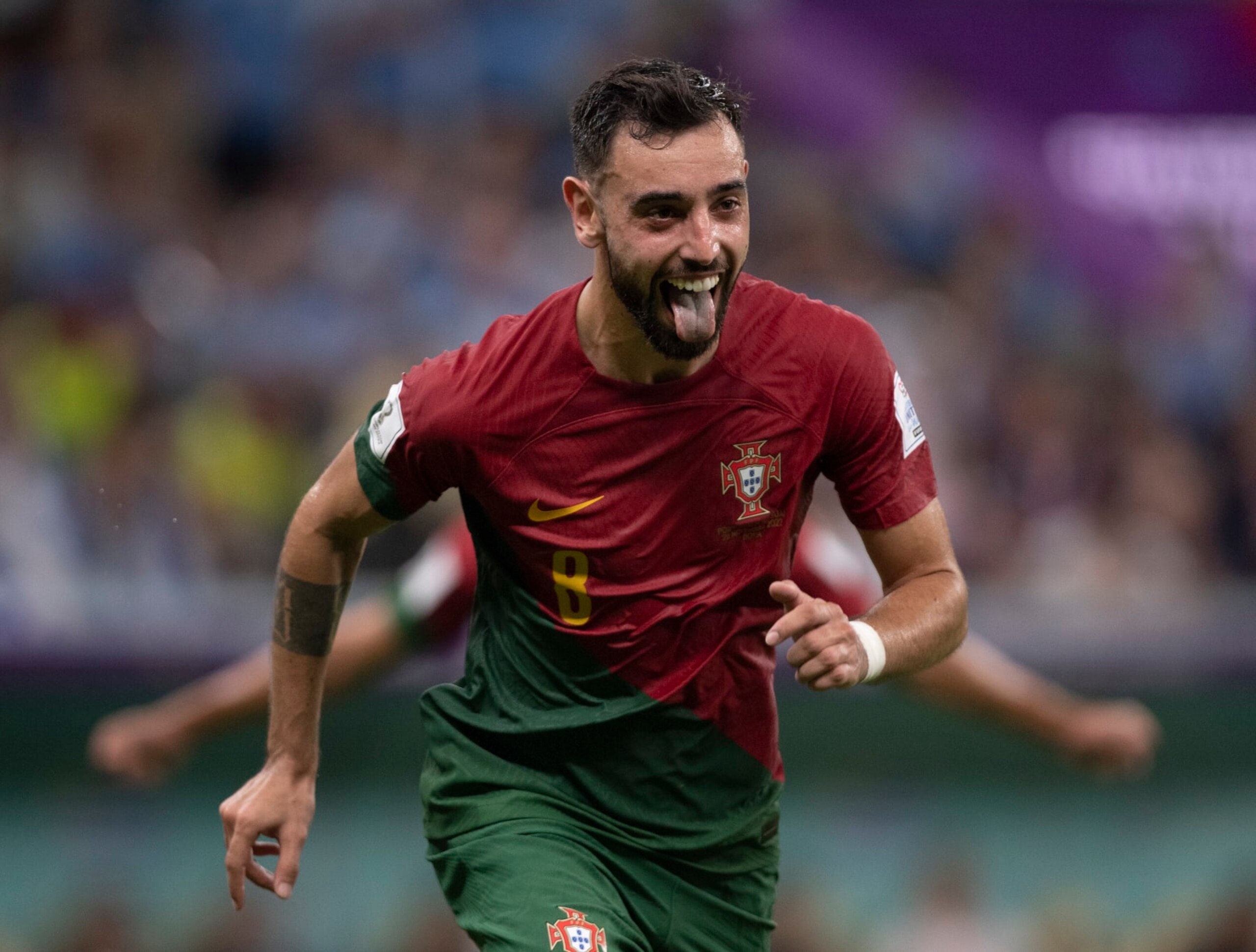 LUSAIL CITY, QATAR - NOVEMBER 28: Bruno Fernandes of Portugal celebrates scoring his second goal from the penalty spot during the FIFA World Cup Qatar 2022 Group H match between Portugal and Uruguay at Lusail Stadium on November 28, 2022 in Lusail City, Qatar. (Photo by Visionhaus/Getty Images)