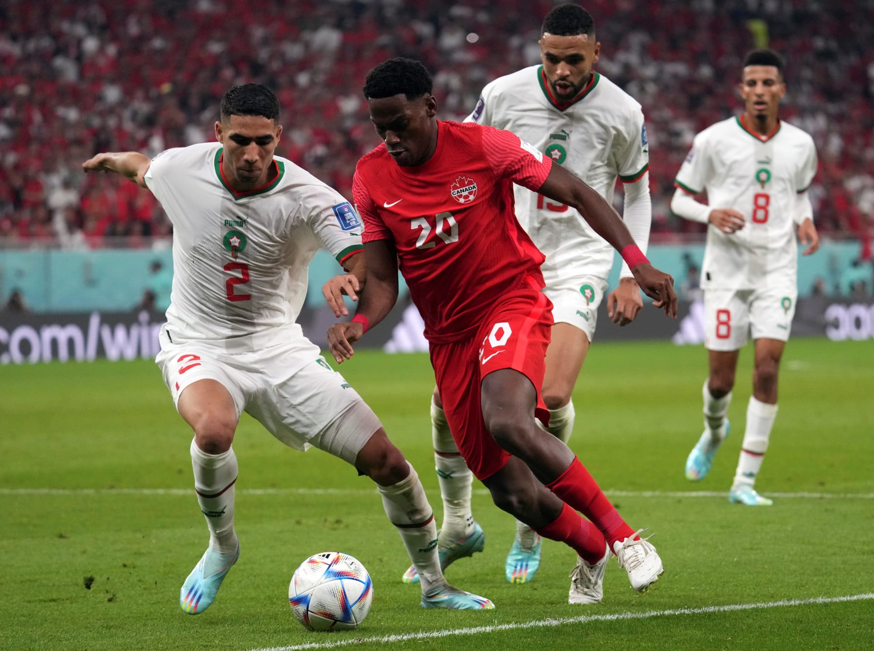 Achraf Hakimi L of Morocco and Jonathan David of Canada in action during their Group F match at the 2022 FIFA World Cup at Al Thumama Stadium in Doha, Qatar, Dec. 1, 2022. (Photo by Li Gang/Xinhua via Getty Images)