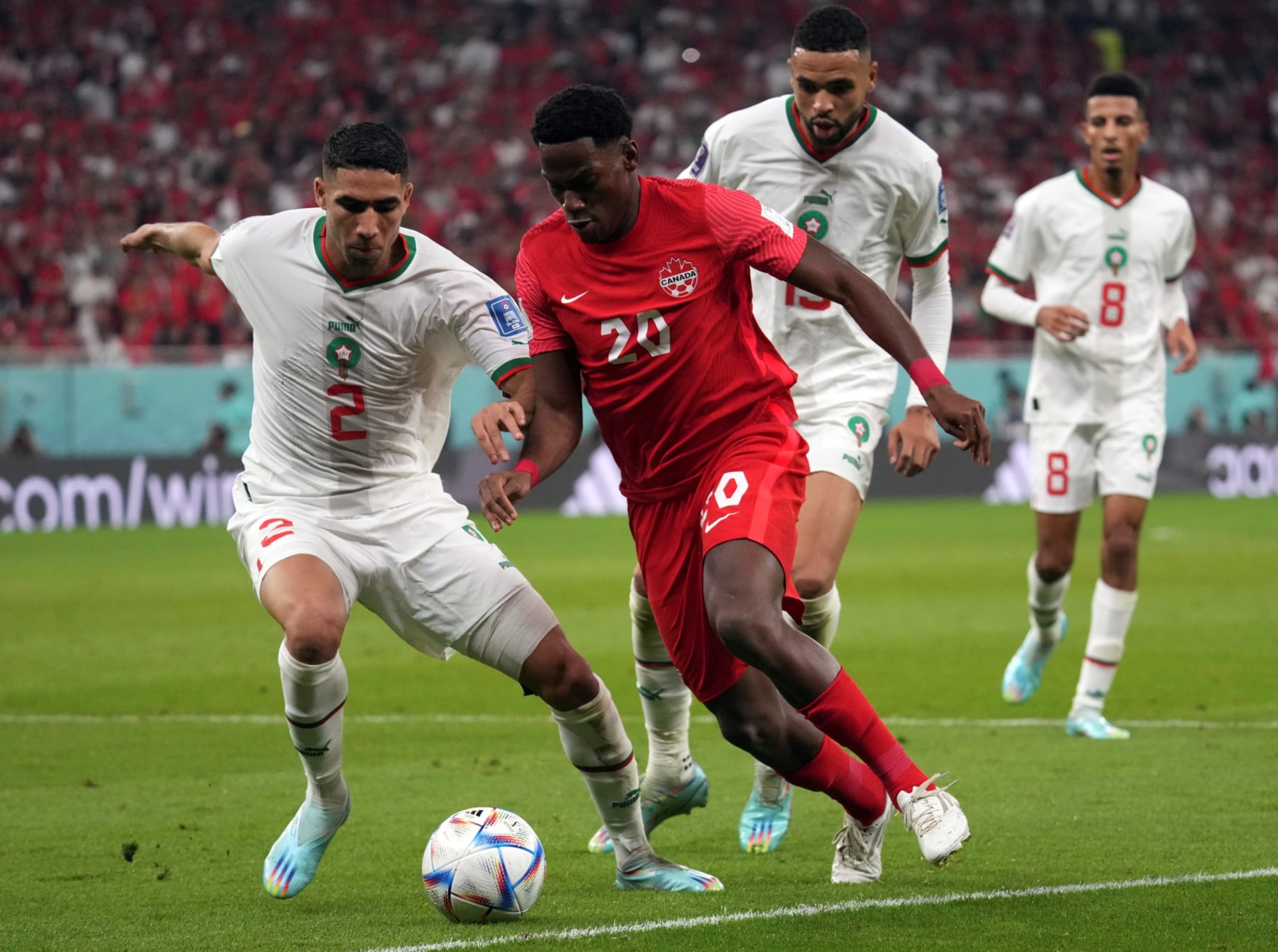 Achraf Hakimi L of Morocco and Jonathan David of Canada in action during their Group F match at the 2022 FIFA World Cup at Al Thumama Stadium in Doha, Qatar, Dec. 1, 2022. (Photo by Li Gang/Xinhua via Getty Images)