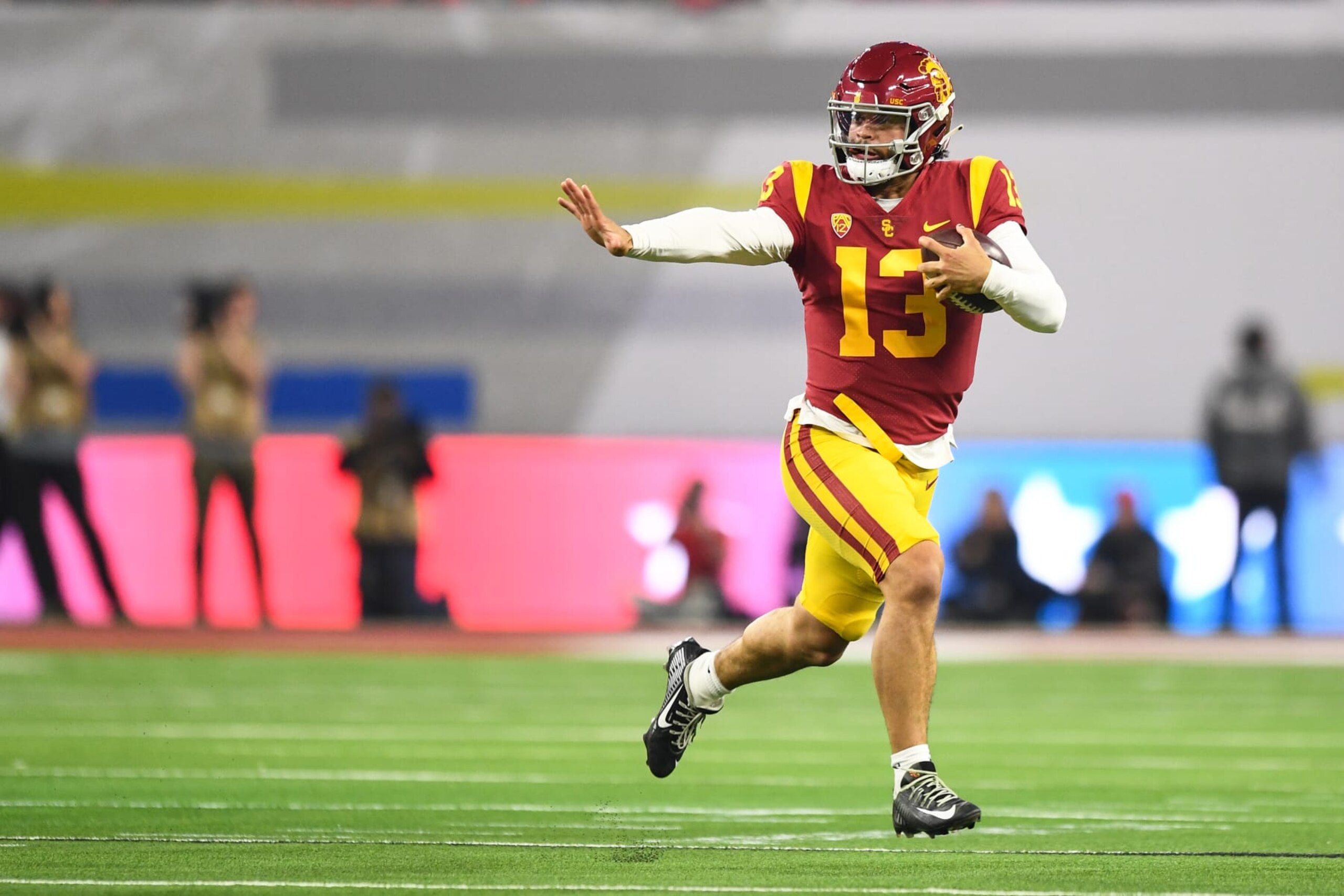 LAS VEGAS, NV - DECEMBER 02: USC Trojans quarterback Caleb Williams (13) runs up field during the Pac-12 Conference championship game between the Utah Utes and the USC Trojans at Allegiant Stadium on December 2, 2022 in Las Vegas, Nevada. (Photo by Brian Rothmuller/Icon Sportswire via Getty Images)