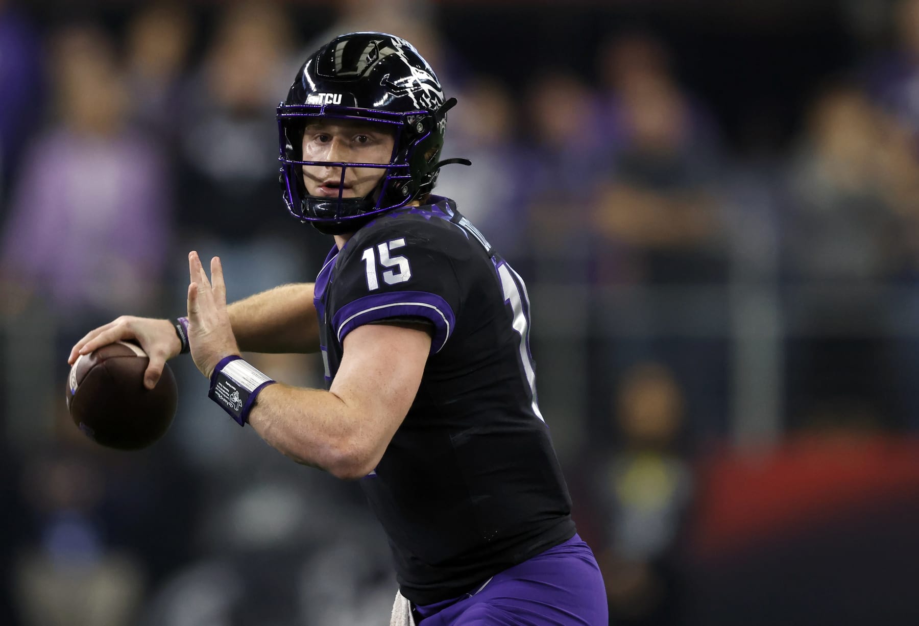 ARLINGTON, TX - DECEMBER 3: Max Duggan #15 of the TCU Horned Frogs looks to throw against the Kansas State Wildcats in the first half of the Big 12 Football Championship at AT&T Stadium on December 3, 2022 in Arlington, Texas.  (Photo by Ron Jenkins/Getty Images)