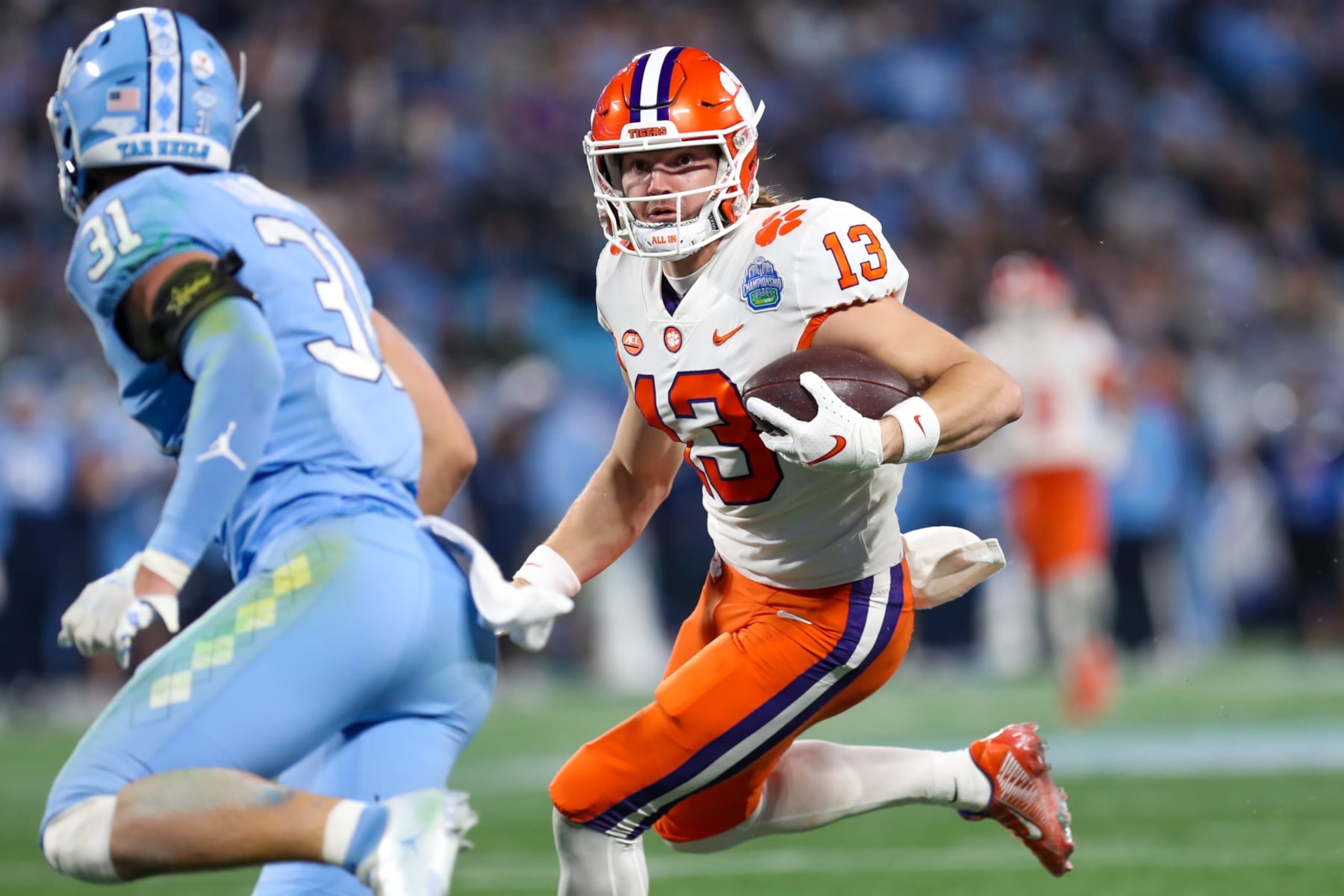 CHARLOTTE, NC - DECEMBER 03: Brannon Spector (13) of the Clemson Tigers runs the ball after making a catch during the ACC Championship football game between the North Carolina Tar Heels and the Clemson Tigers on December 3, 2022 at Bank of America Stadium in Charlotte, NC. (Photo by David Jensen/Icon Sportswire via Getty Images)