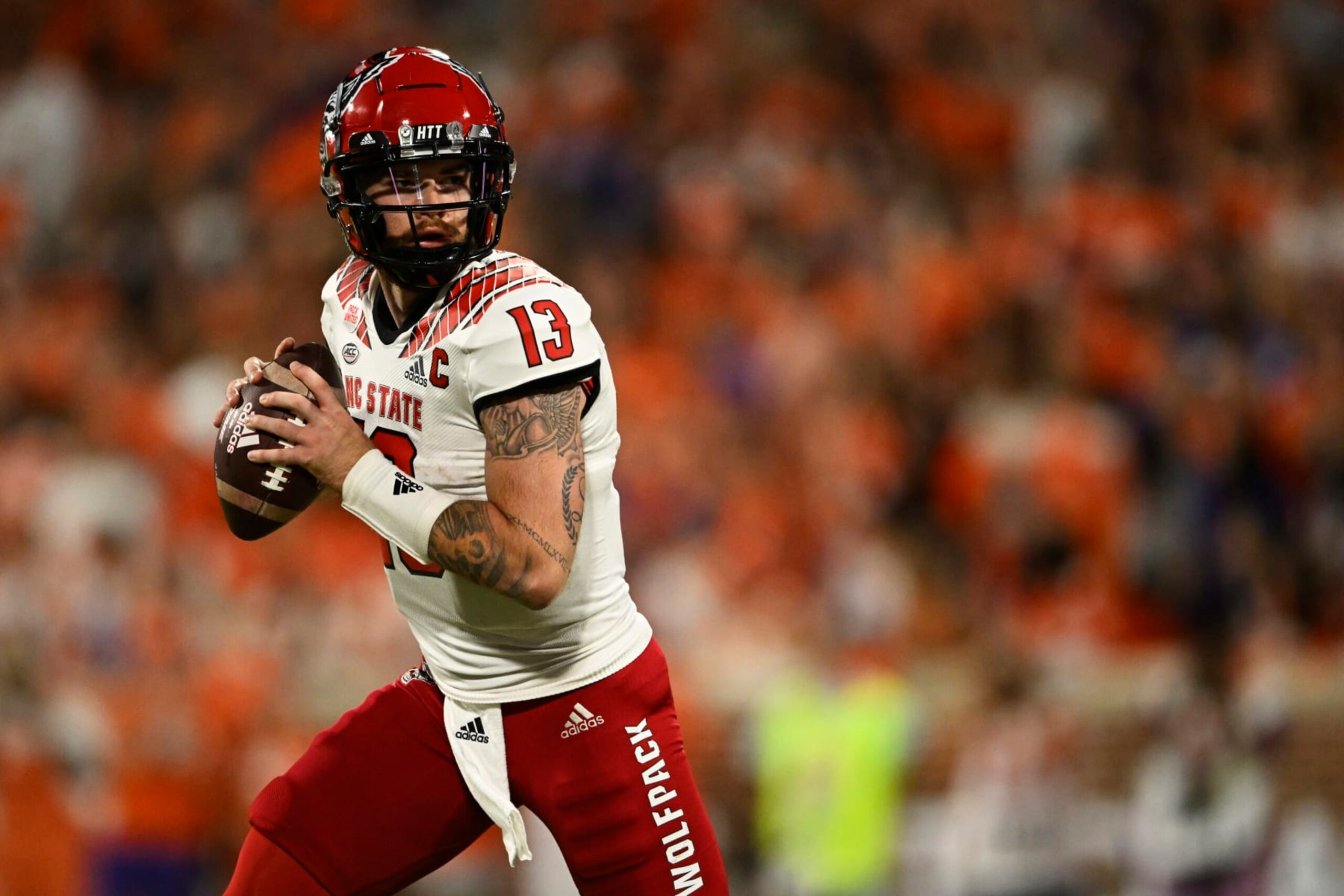 CLEMSON, SOUTH CAROLINA - OCTOBER 01: Devin Leary #13 of the North Carolina State Wolfpack looks for a pass in the second quarter against the Clemson Tigers at Memorial Stadium on October 01, 2022 in Clemson, South Carolina. (Photo by Eakin Howard/Getty Images)