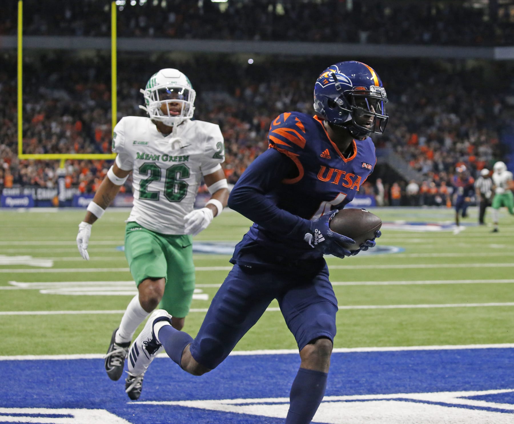 SAN ANTONIO, TX - DECEMBER 2:  Wide receiver Zachari Franklin #4 of the UTSA Roadrunners scores on a touchdown reception against North Texas Mean Green in the  first half at Alamodome on December 2, 2022 in San Antonio, Texas.  (Photo by Ronald Cortes/Getty Images)