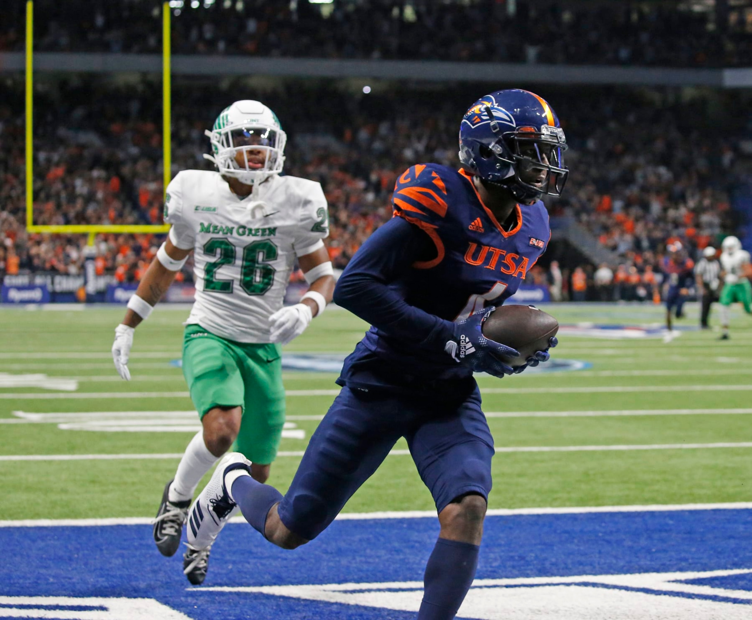 SAN ANTONIO, TX - DECEMBER 2:  Wide receiver Zachari Franklin #4 of the UTSA Roadrunners scores on a touchdown reception against North Texas Mean Green in the  first half at Alamodome on December 2, 2022 in San Antonio, Texas.  (Photo by Ronald Cortes/Getty Images)