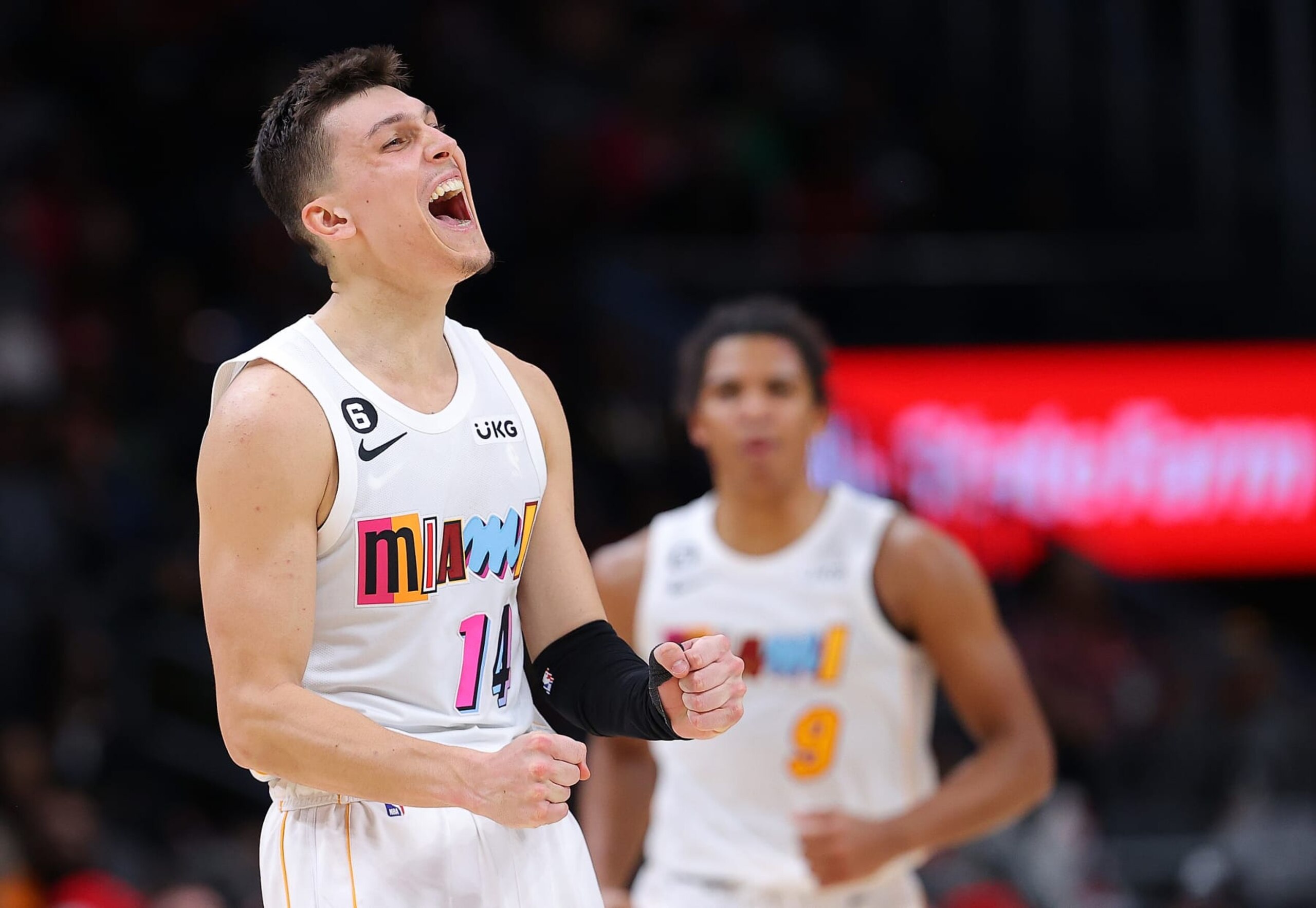 ATLANTA, GEORGIA - NOVEMBER 27:  Tyler Herro #14 of the Miami Heat reacts after a three-point basket by Dru Smith #9 against the Atlanta Hawks during the second half at State Farm Arena on November 27, 2022 in Atlanta, Georgia.  NOTE TO USER: User expressly acknowledges and agrees that, by downloading and or using this photograph, User is consenting to the terms and conditions of the Getty Images License Agreement.  (Photo by Kevin C. Cox/Getty Images)