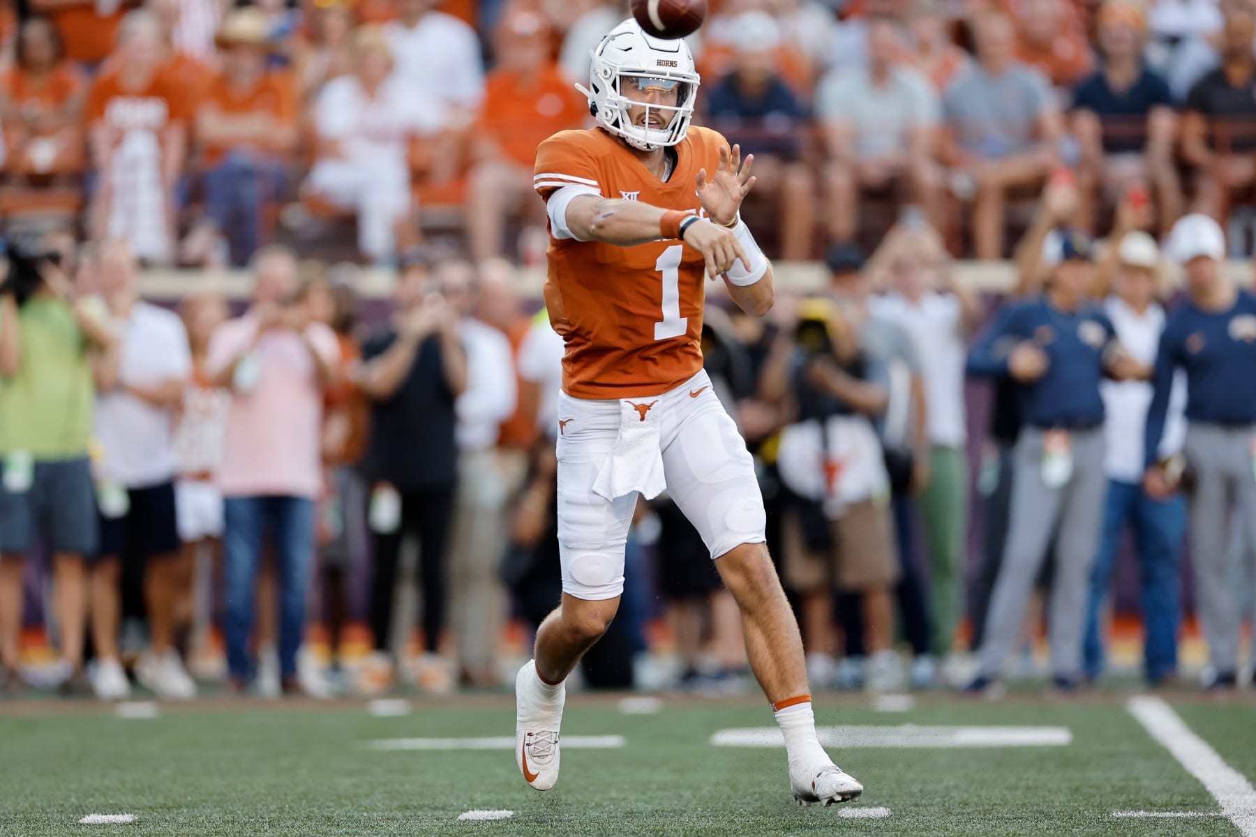 AUSTIN, TEXAS - OCTOBER 01: Hudson Card #1 of the Texas Longhorns throws a pass in the first quarter against the West Virginia Mountaineers at Darrell K Royal-Texas Memorial Stadium on October 01, 2022 in Austin, Texas. (Photo by Tim Warner/Getty Images)
