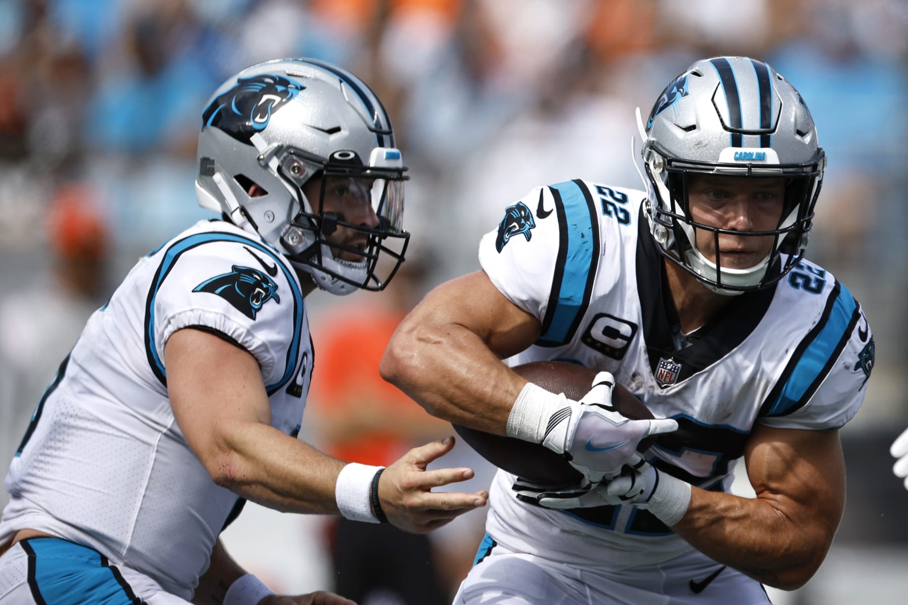 CHARLOTTE, NORTH CAROLINA - SEPTEMBER 11: Quarterback Baker Mayfield #6 of the Carolina Panthers hands the ball to running back Christian McCaffrey #22 during the second half of their NFL game against the Cleveland Browns at Bank of America Stadium on September 11, 2022 in Charlotte, North Carolina. (Photo by Jared C. Tilton/Getty Images)