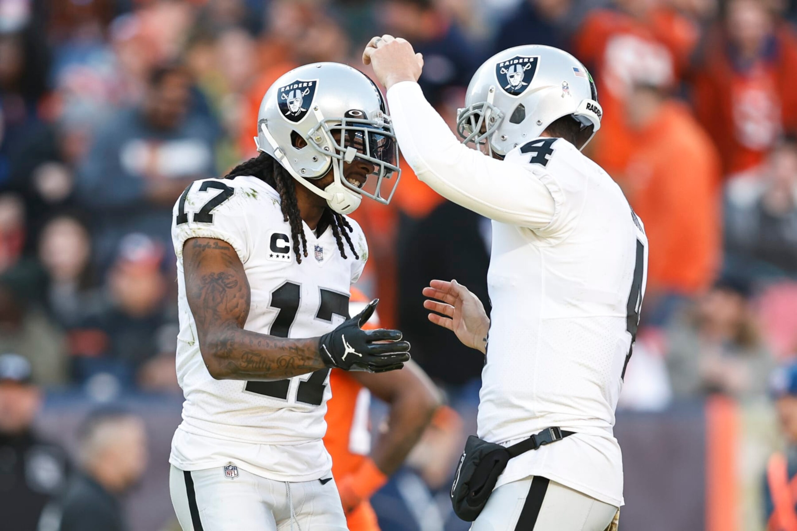 DENVER, COLORADO - NOVEMBER 20: Davante Adams #17 of the Las Vegas Raiders celebrates with Derek Carr #4 of the Las Vegas Raiders after completing a pass for a touchdown during an NFL game between the Las Vegas Raiders and Denver Broncos at Empower Field At Mile High on November 20, 2022 in Denver, Colorado. The Las Vegas Raiders won in overtime (Photo by Michael Owens/Getty Images)