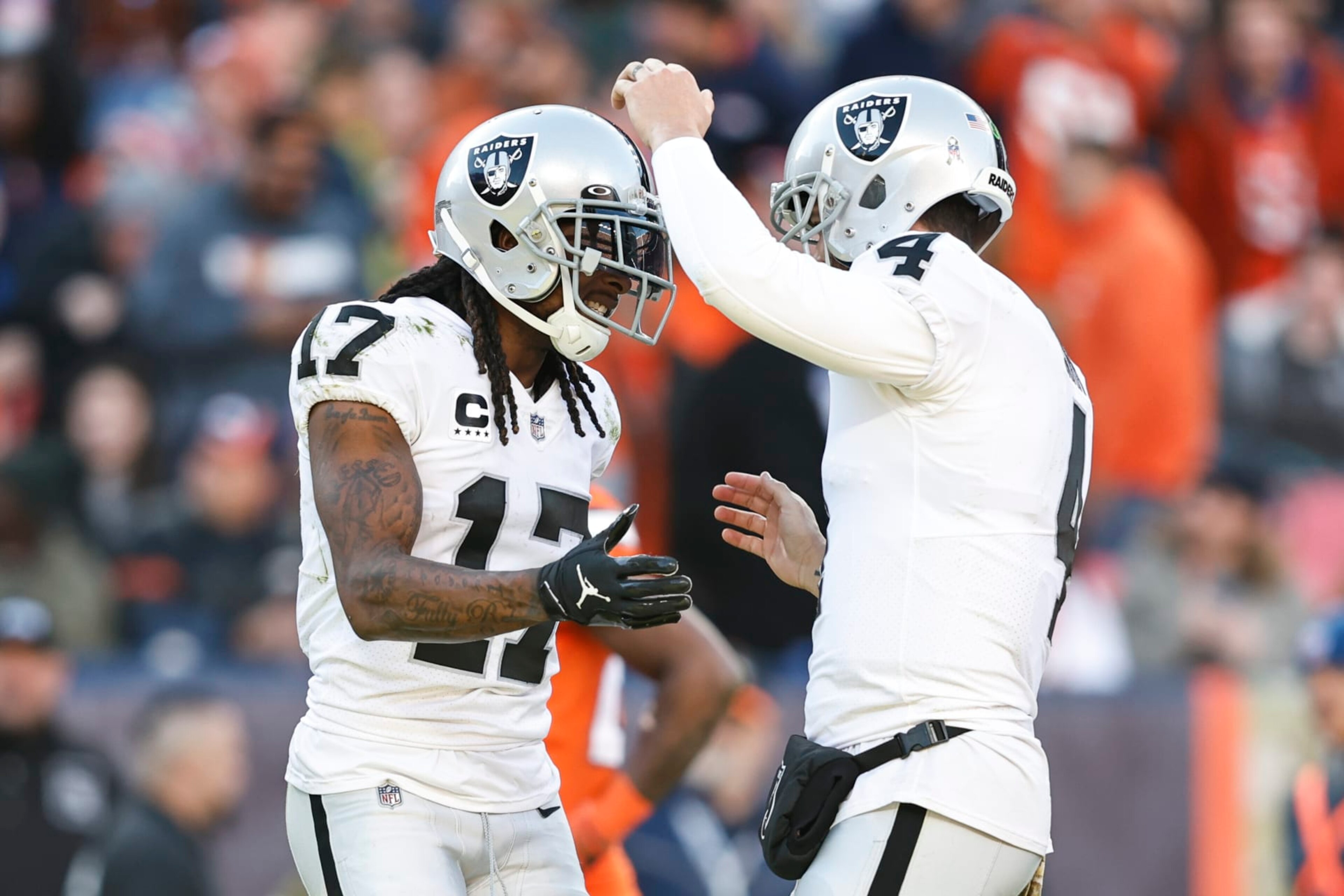 DENVER, COLORADO - NOVEMBER 20: Davante Adams #17 of the Las Vegas Raiders celebrates with Derek Carr #4 of the Las Vegas Raiders after completing a pass for a touchdown during an NFL game between the Las Vegas Raiders and Denver Broncos at Empower Field At Mile High on November 20, 2022 in Denver, Colorado. The Las Vegas Raiders won in overtime (Photo by Michael Owens/Getty Images)
