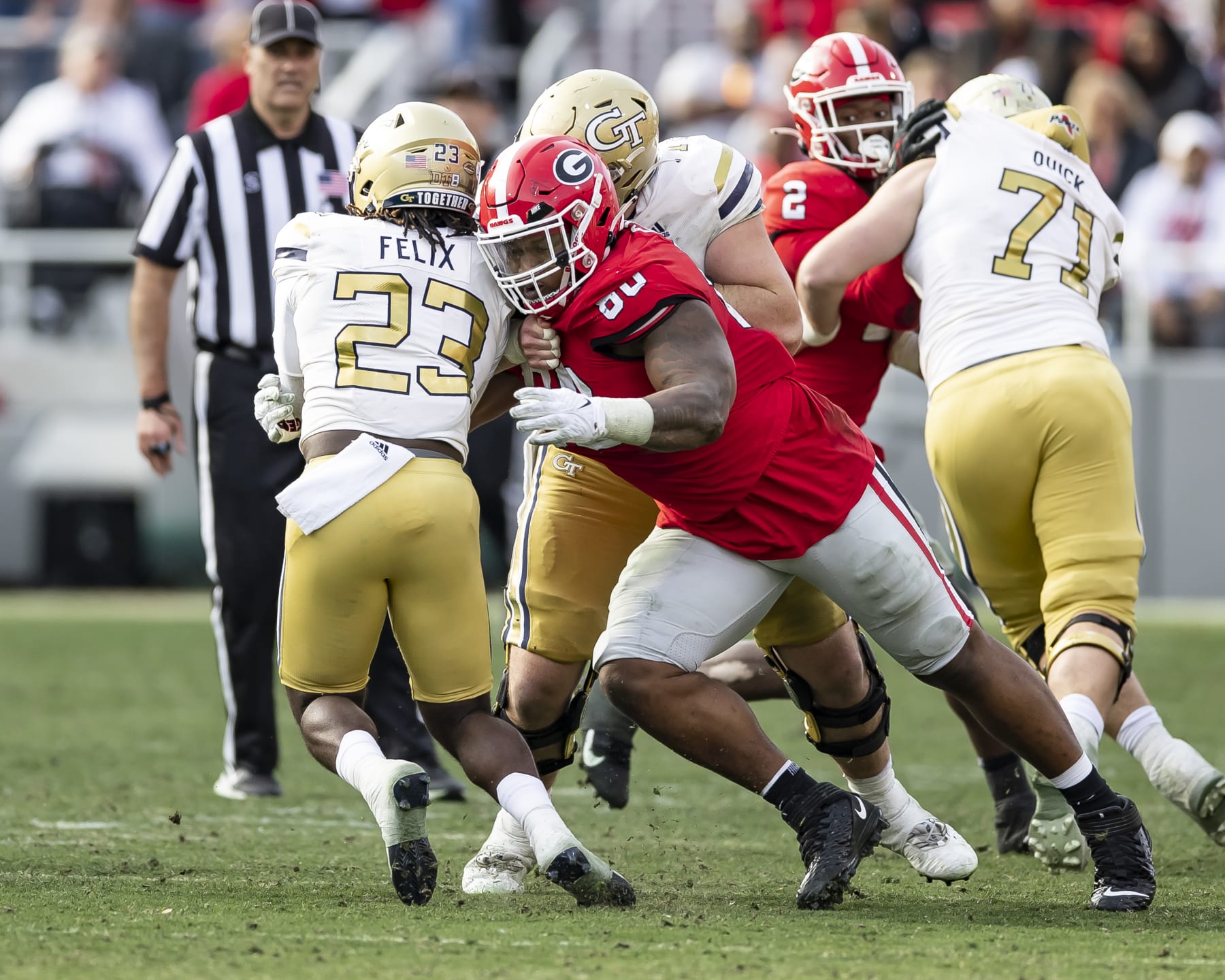ATHENS, GA - NOVEMBER 26: Jalen Carter #88 of the Georgia Bulldogs closes in on Jamie Felix #23 of the Georgia Tech Yellow Jackets during a game between Georgia Tech Yellow Jackets and Georgia Bulldogs at Sanford Stadium on November 26, 2022 in Athens, Georgia. (Photo by Steve Limentani/ISI Photos/Getty Images)