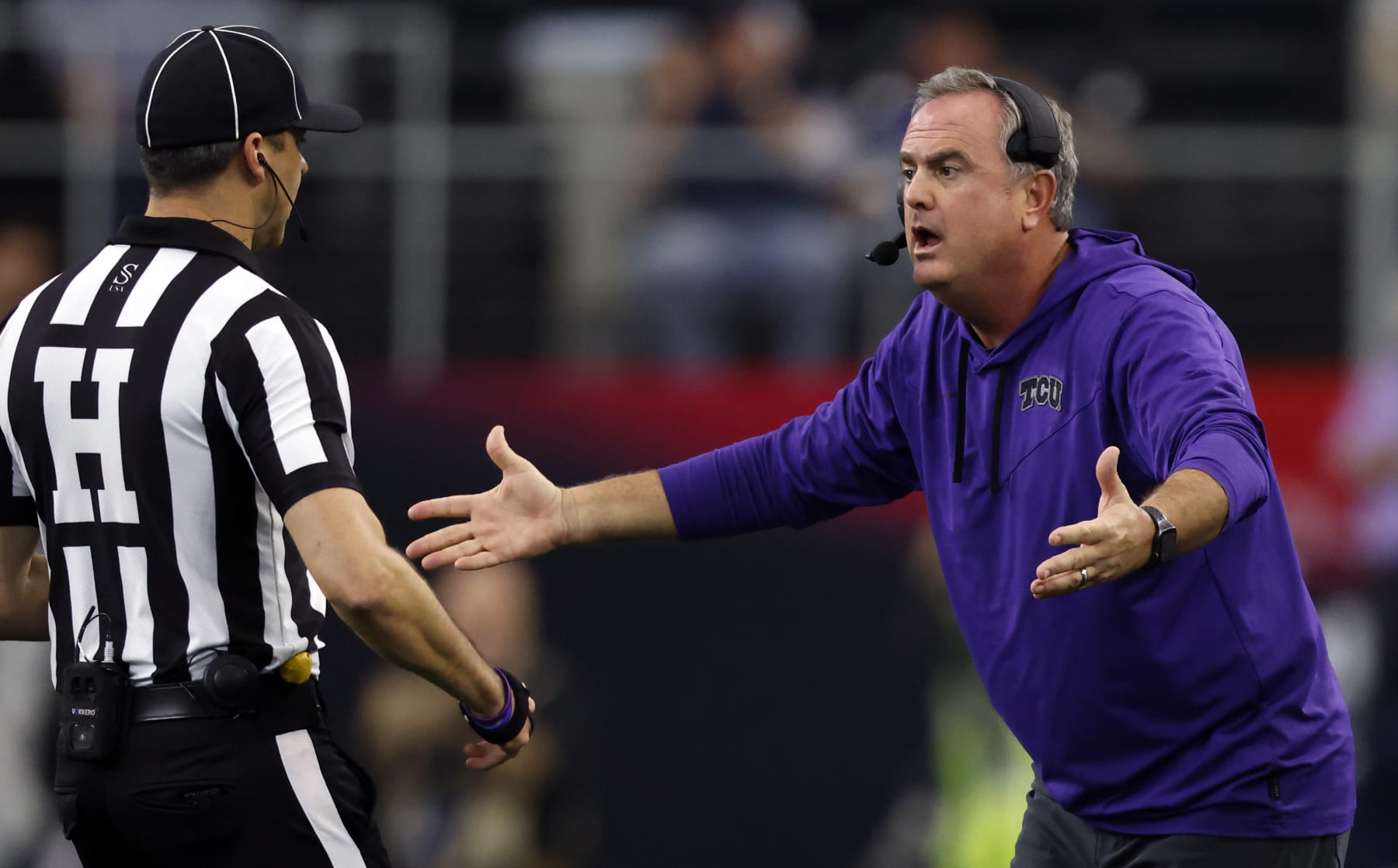 ARLINGTON, TX - DECEMBER 3: Head coach Sonny Dykes of the TCU Horned Frogs questions at a game official as TCU takes on the Kansas State Wildcats in the second half of the Big 12 Football Championship at AT&T Stadium on December 3, 2022 in Arlington, Texas.  (Photo by Ron Jenkins/Getty Images)