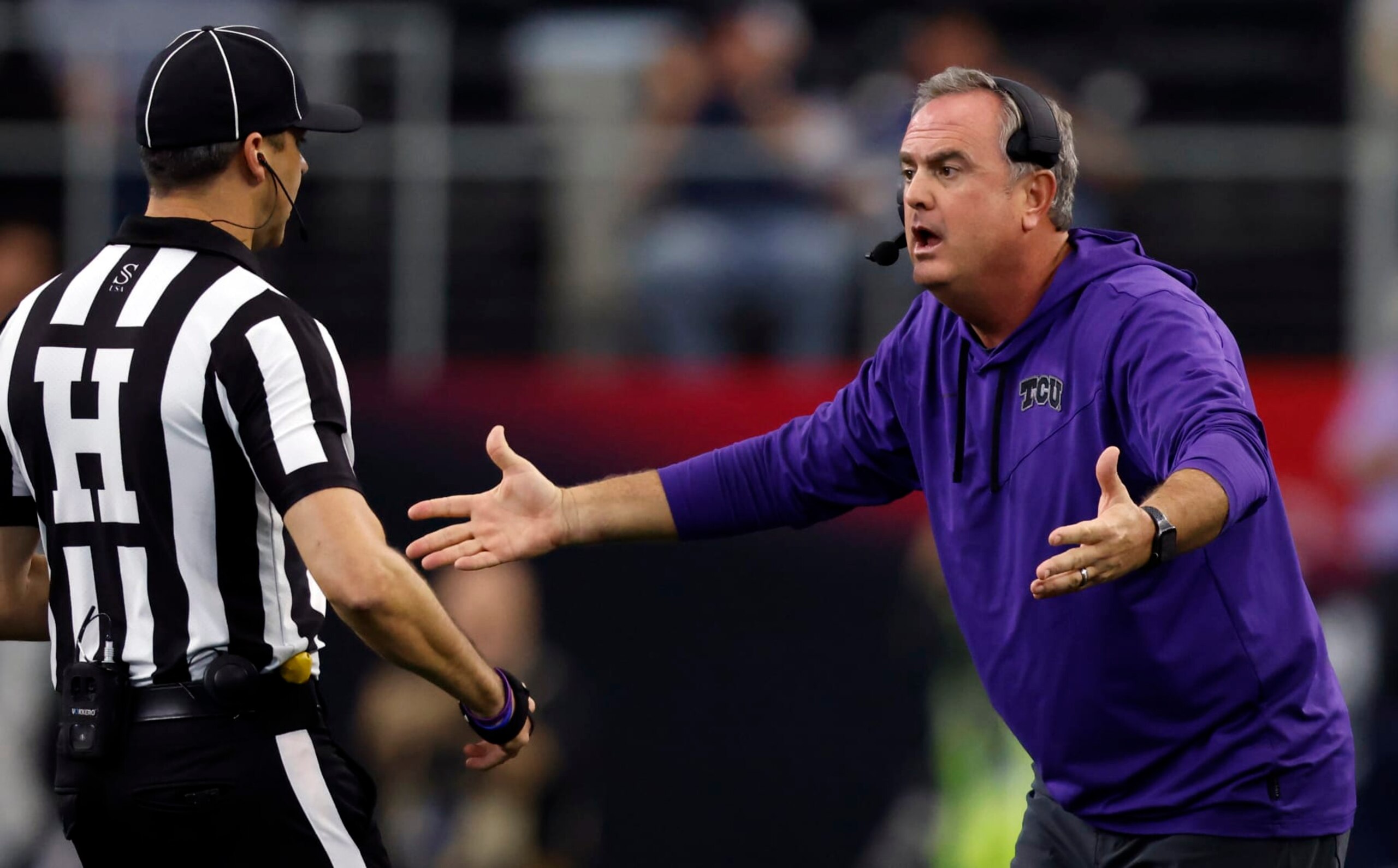 ARLINGTON, TX - DECEMBER 3: Head coach Sonny Dykes of the TCU Horned Frogs questions at a game official as TCU takes on the Kansas State Wildcats in the second half of the Big 12 Football Championship at AT&T Stadium on December 3, 2022 in Arlington, Texas.  (Photo by Ron Jenkins/Getty Images)
