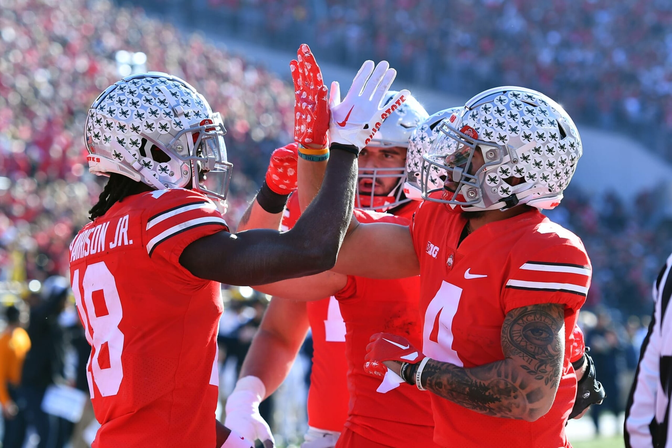 COLUMBUS, OHIO - NOVEMBER 26: Marvin Harrison Jr. #18 of the Ohio State Buckeyes celebrates his second quarter touchdown with teammate Julian Fleming #4 of the Ohio State Buckeyes during a game against the Michigan Wolverinesat Ohio Stadium on November 26, 2022 in Columbus, Ohio. (Photo by Ben Jackson/Getty Images)