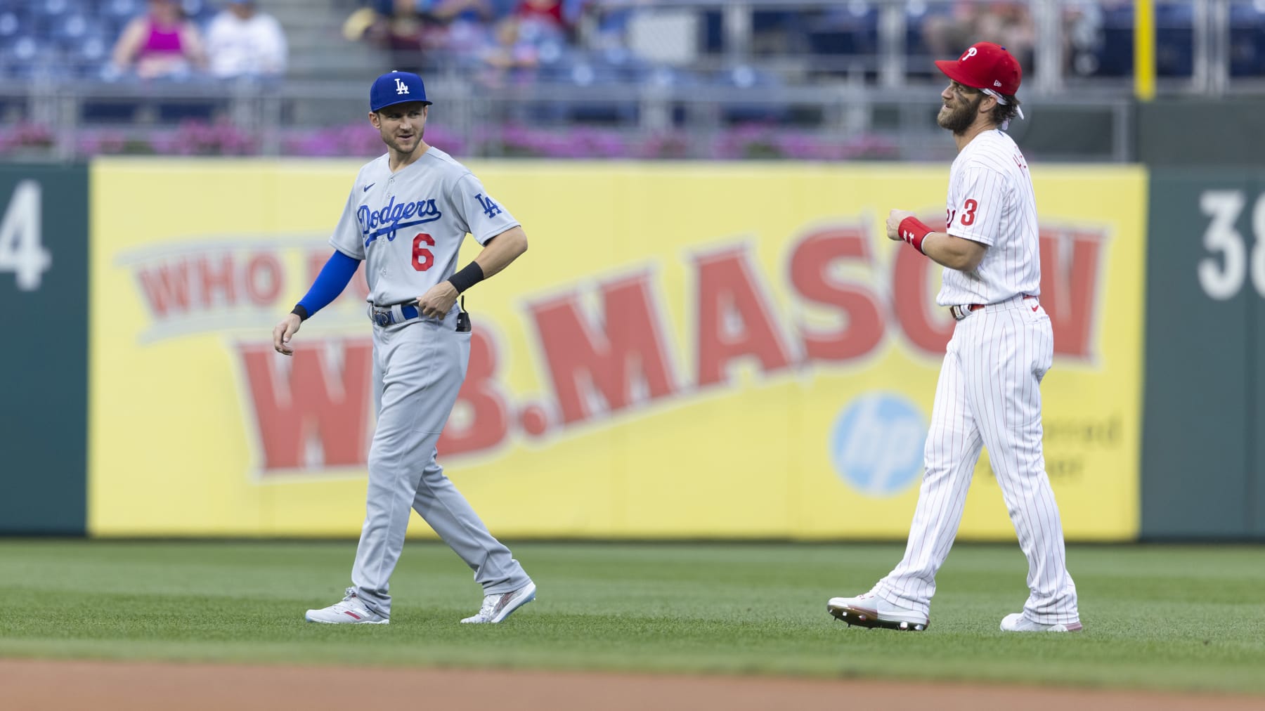 PHILADELPHIA, PA - AUGUST 11: Trea Turner #6 of the Los Angeles Dodgers talks to Bryce Harper #3 of the Philadelphia Phillies at Citizens Bank Park on August 11, 2021 in Philadelphia, Pennsylvania. The Dodgers defeated the Phillies 8-2. (Photo by Mitchell Leff/Getty Images)