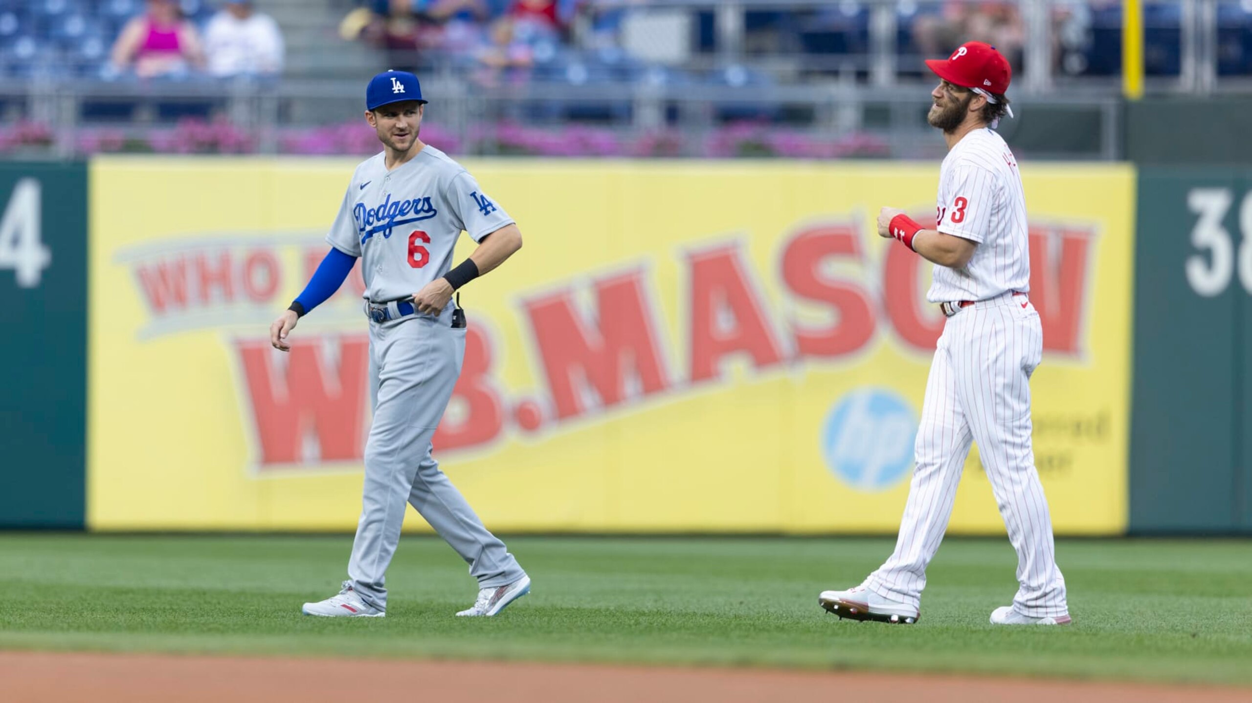 PHILADELPHIA, PA - AUGUST 11: Trea Turner #6 of the Los Angeles Dodgers talks to Bryce Harper #3 of the Philadelphia Phillies at Citizens Bank Park on August 11, 2021 in Philadelphia, Pennsylvania. The Dodgers defeated the Phillies 8-2. (Photo by Mitchell Leff/Getty Images)