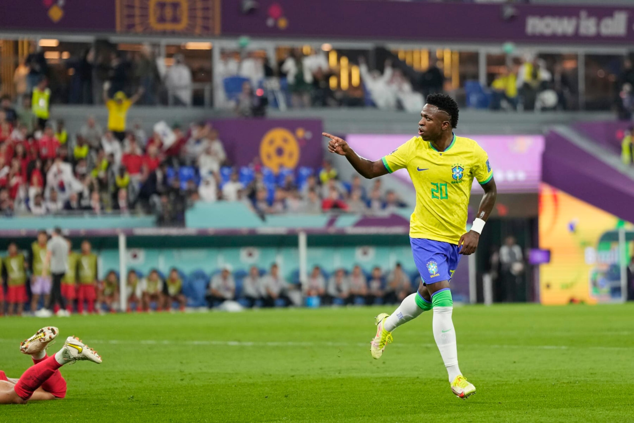 Brazil's Vinicius Junior celebrates after scoring his side's opening goal during the World Cup round of 16 soccer match between Brazil and South Korea at the Stadium 974 in Doha, Qatar, Monday, Dec. 5, 2022. (AP Photo/Jin-Man Lee)