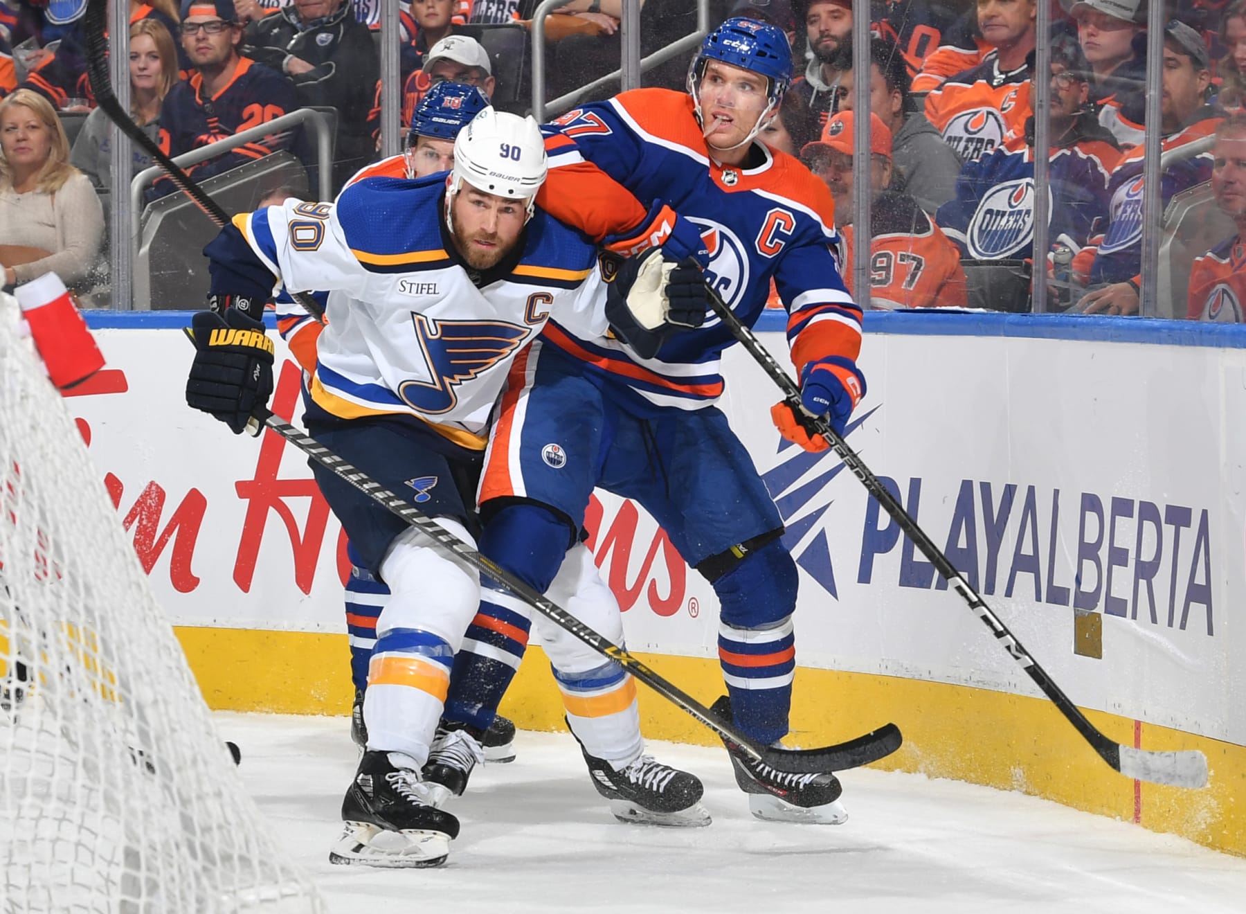 EDMONTON, CANADA - OCTOBER 22: Connor McDavid #97 of the Edmonton Oilers battles for position with Ryan O'Reilly #90 of the St. Louis Blues during the game on October 22, 2022 at Rogers Place in Edmonton, Alberta, Canada. (Photo by Andy Devlin/NHLI via Getty Images)