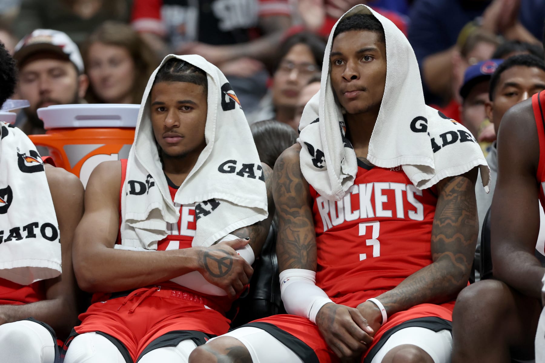 DENVER, COLORADO - NOVEMBER 28: Jalen Green #4 and Kevin Porter Jr. #3 of the Houston Rockets watch from the bench as their team plays the Denver Nuggets in the fourth quarter at Ball Arena on November 28, 2022 in Denver, Colorado. NOTE TO USER: User expressly acknowledges and agrees that, by downloading and/or using this photograph, User is consenting to the terms and conditions of the Getty Images License Agreement. (Photo by Matthew Stockman/Getty Images)