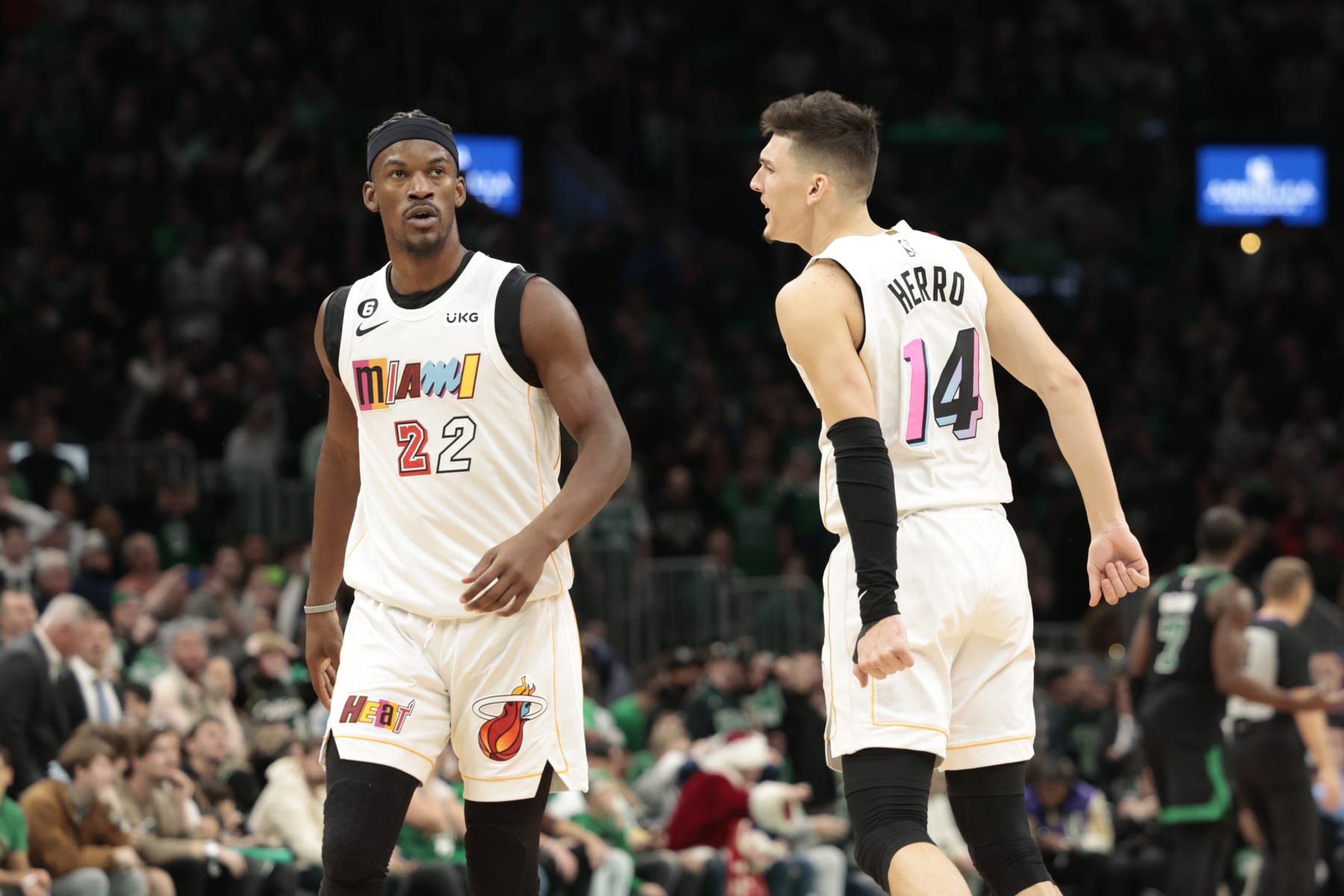 BOSTON, MASSACHUSETTS - DECEMBER 02: Tyler Herro #14 of the Miami Heat reacts with Jimmy Butler #22 of the Miami Heat during the fourth quarter against the Boston Celtics at TD Garden on December 02, 2022 in Boston, Massachusetts. NOTE TO USER: User expressly acknowledges and agrees that, by downloading and or using this photograph, User is consenting to the terms and conditions of the Getty Images License Agreement. (Photo by Nick Grace/Getty Images)