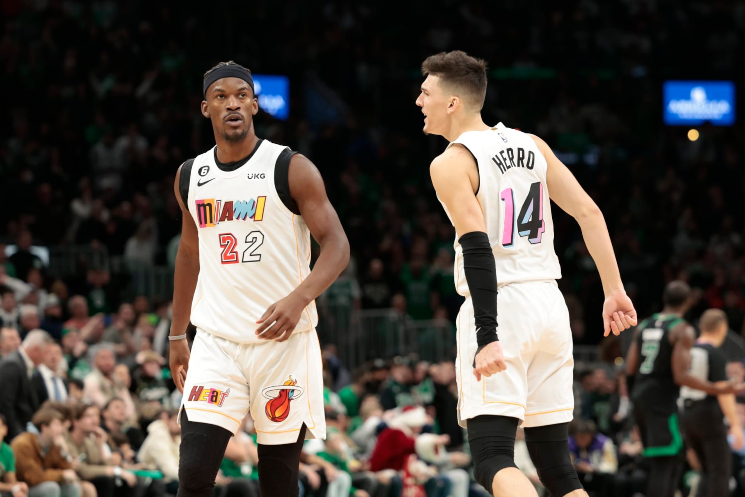 BOSTON, MASSACHUSETTS - DECEMBER 02: Tyler Herro #14 of the Miami Heat reacts with Jimmy Butler #22 of the Miami Heat during the fourth quarter against the Boston Celtics at TD Garden on December 02, 2022 in Boston, Massachusetts. NOTE TO USER: User expressly acknowledges and agrees that, by downloading and or using this photograph, User is consenting to the terms and conditions of the Getty Images License Agreement. (Photo by Nick Grace/Getty Images) BOSTON, MASSACHUSETTS - DECEMBER 02: Tyler Herro #14 of the Miami Heat reacts with Jimmy Butler #22 of the Miami Heat during the fourth quarter against the Boston Celtics at TD Garden on December 02, 2022 in Boston, Massachusetts. NOTE TO USER: User expressly acknowledges and agrees that, by downloading and or using this photograph, User is consenting to the terms and conditions of the Getty Images License Agreement. (Photo by Nick Grace/Getty Images)