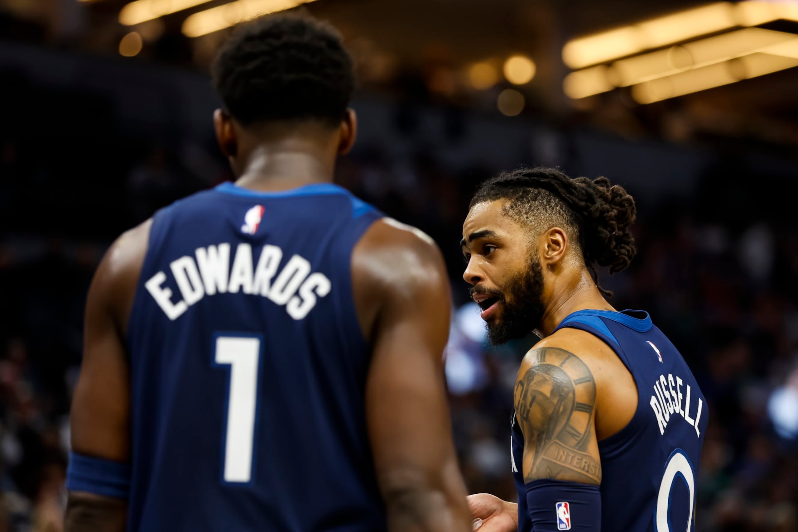 MINNEAPOLIS, MN - NOVEMBER 30: D'Angelo Russell #0 and Anthony Edwards #1 of the Minnesota Timberwolves look on against the Memphis Grizzlies in the third quarter of the game at Target Center on November 30, 2022 in Minneapolis, Minnesota. The Timberwolves defeated the Grizzlies 109-101. NOTE TO USER: User expressly acknowledges and agrees that, by downloading and or using this Photograph, user is consenting to the terms and conditions of the Getty Images License Agreement. (Photo by David Berding/Getty Images) MINNEAPOLIS, MN - NOVEMBER 30: D'Angelo Russell #0 and Anthony Edwards #1 of the Minnesota Timberwolves look on against the Memphis Grizzlies in the third quarter of the game at Target Center on November 30, 2022 in Minneapolis, Minnesota. The Timberwolves defeated the Grizzlies 109-101. NOTE TO USER: User expressly acknowledges and agrees that, by downloading and or using this Photograph, user is consenting to the terms and conditions of the Getty Images License Agreement. (Photo by David Berding/Getty Images)