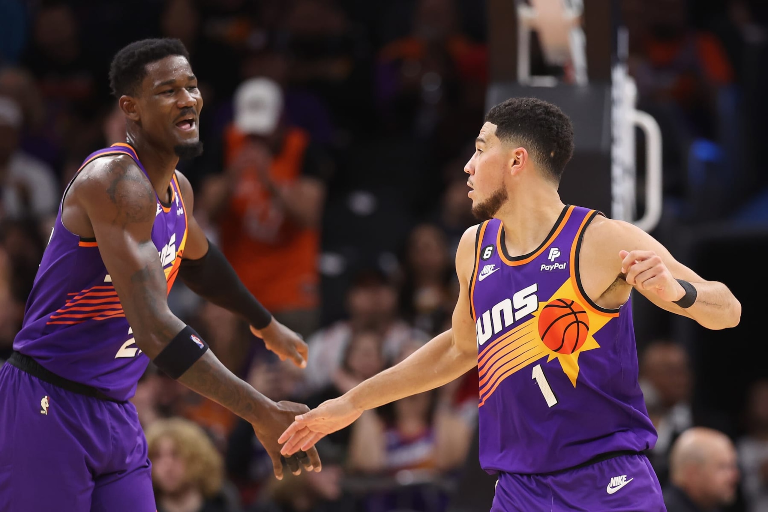 PHOENIX, ARIZONA - NOVEMBER 30: Deandre Ayton #22 and Devin Booker #1 of the Phoenix Suns celebrate after scoring against the Chicago Bulls during the second half of the NBA game at Footprint Center on November 30, 2022 in Phoenix, Arizona. The Suns defeated the Bulls 132-113. NOTE TO USER: User expressly acknowledges and agrees that, by downloading and or using this photograph, User is consenting to the terms and conditions of the Getty Images License Agreement. (Photo by Christian Petersen/Getty Images) PHOENIX, ARIZONA - NOVEMBER 30: Deandre Ayton #22 and Devin Booker #1 of the Phoenix Suns celebrate after scoring against the Chicago Bulls during the second half of the NBA game at Footprint Center on November 30, 2022 in Phoenix, Arizona. The Suns defeated the Bulls 132-113. NOTE TO USER: User expressly acknowledges and agrees that, by downloading and or using this photograph, User is consenting to the terms and conditions of the Getty Images License Agreement. (Photo by Christian Petersen/Getty Images)