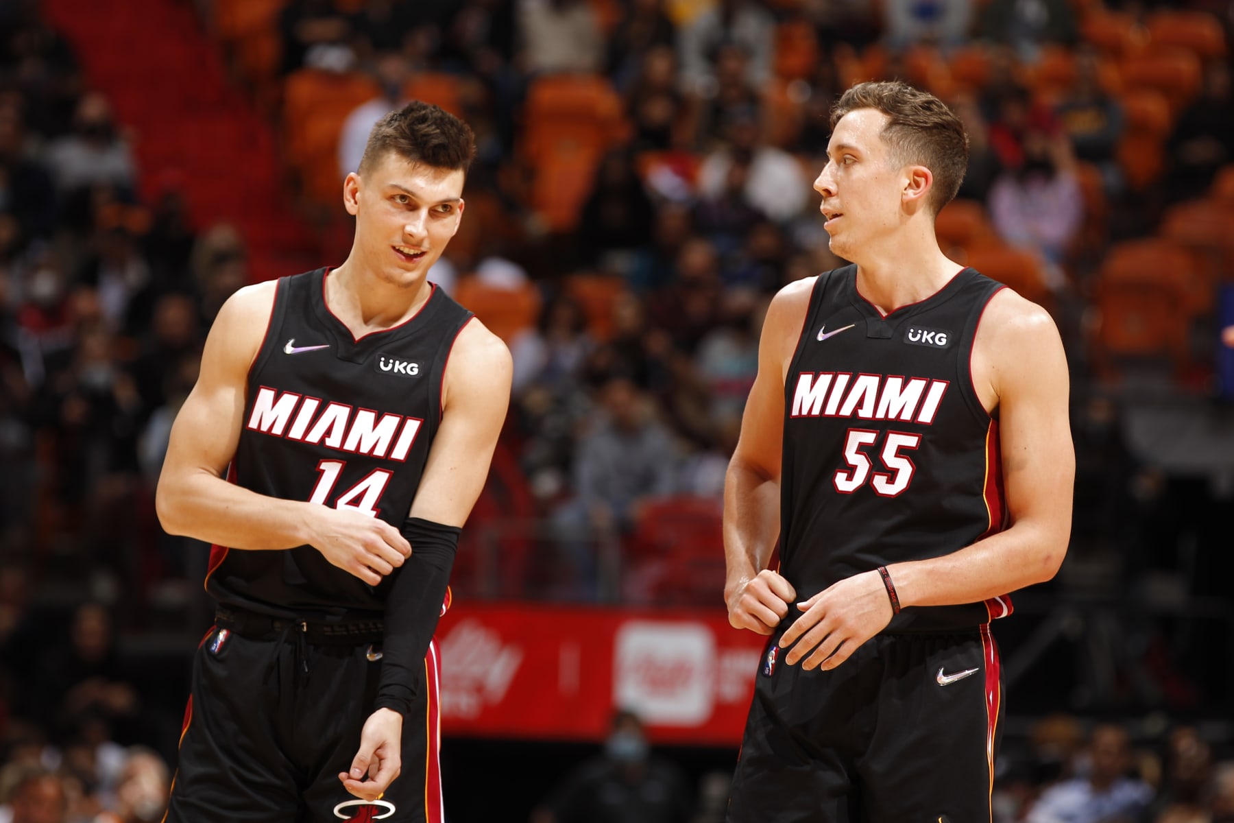 MIAMI, FL - JANUARY 17: Tyler Herro #14 talks to Duncan Robinson #55 of the Miami Heat during the game against the Toronto Raptors on January 17, 2022 at FTX Arena in Miami, Florida. NOTE TO USER: User expressly acknowledges and agrees that, by downloading and or using this Photograph, user is consenting to the terms and conditions of the Getty Images License Agreement. Mandatory Copyright Notice: Copyright 2022 NBAE (Photo by Issac Baldizon/NBAE via Getty Images)