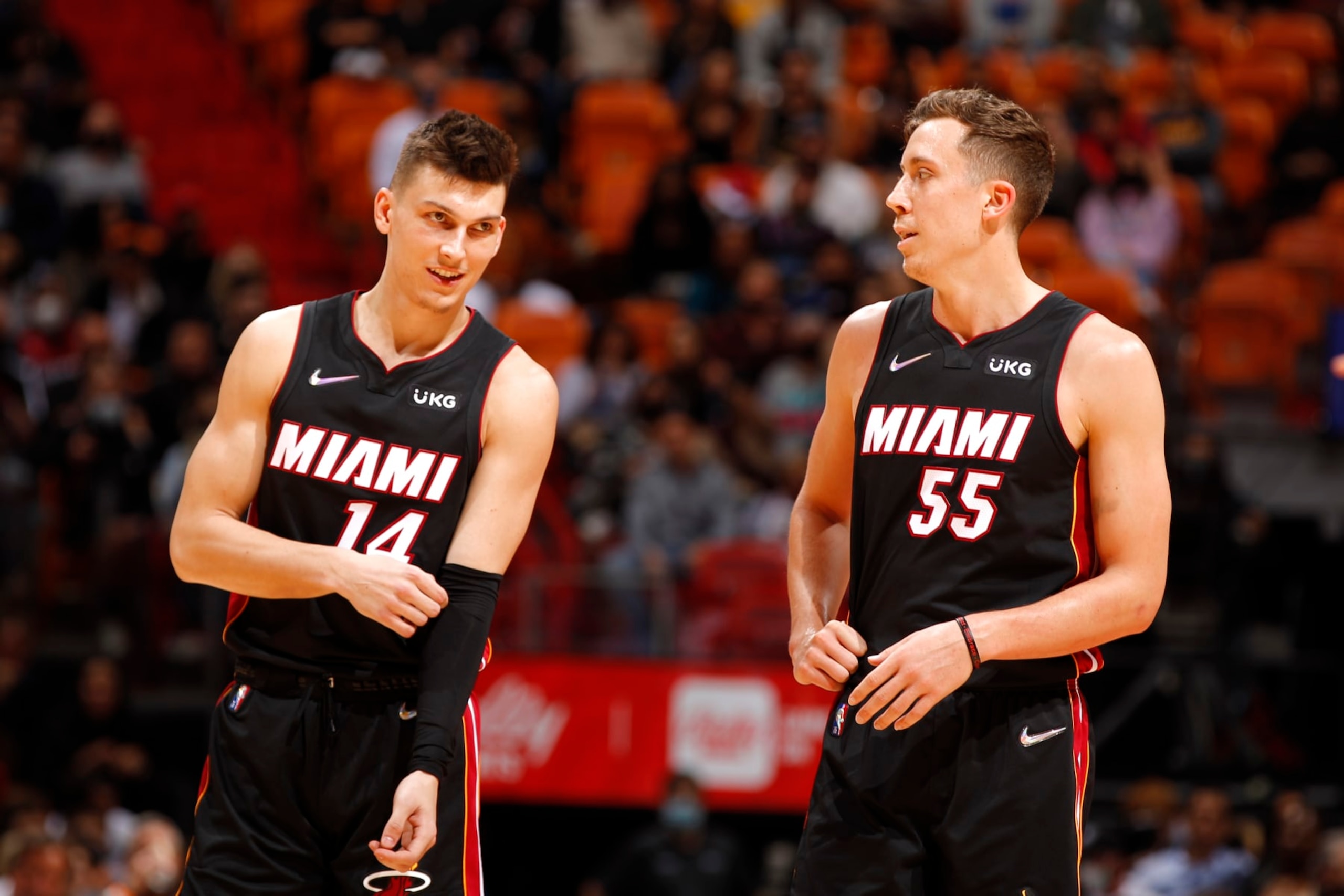 MIAMI, FL - JANUARY 17: Tyler Herro #14 talks to Duncan Robinson #55 of the Miami Heat during the game against the Toronto Raptors on January 17, 2022 at FTX Arena in Miami, Florida. NOTE TO USER: User expressly acknowledges and agrees that, by downloading and or using this Photograph, user is consenting to the terms and conditions of the Getty Images License Agreement. Mandatory Copyright Notice: Copyright 2022 NBAE (Photo by Issac Baldizon/NBAE via Getty Images)