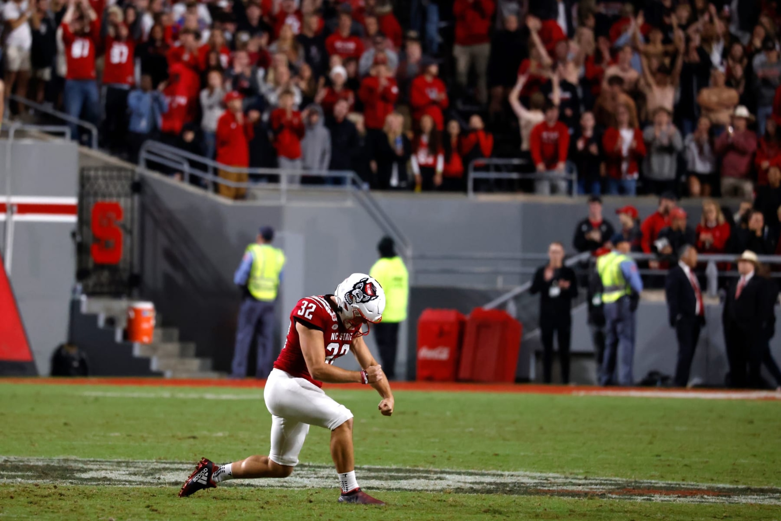 RALEIGH, NC - OCTOBER 08: Christopher Dunn #32 of the North Carolina State Wolfpack reacts after making a field goal with 12:07 remaining in their game against the Florida State Seminoles at Carter-Finley Stadium on October 8, 2022 in Raleigh, North Carolina. NC State won 19-17. (Photo by Lance King/Getty Images)