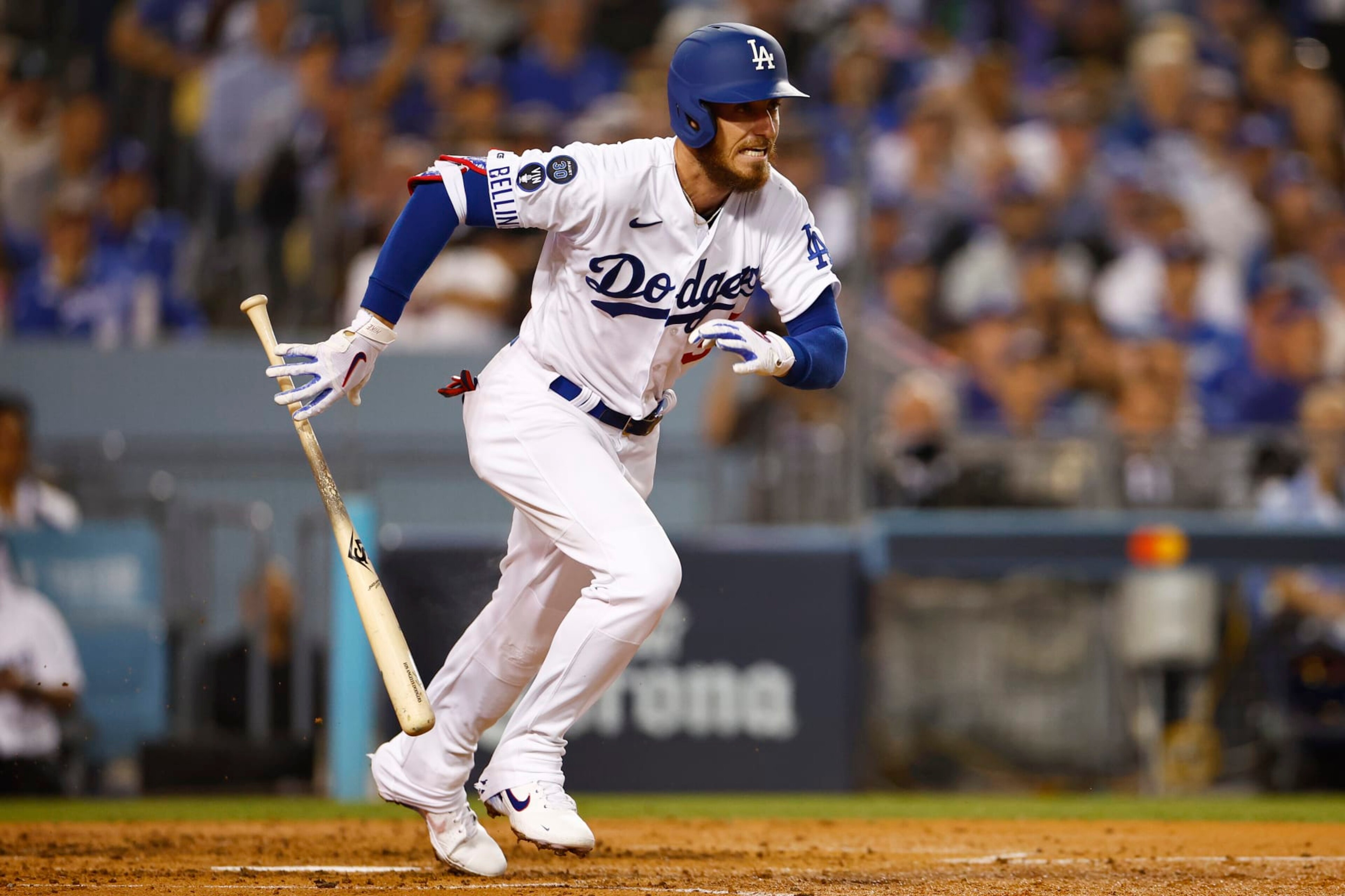 LOS ANGELES, CALIFORNIA - OCTOBER 11: Cody Bellinger #35 of the Los Angeles Dodgers hits and reaches first base on a fielding error by the San Diego Padres during the third inning in game one of the National League Division Series at Dodger Stadium on October 11, 2022 in Los Angeles, California. (Photo by Ronald Martinez/Getty Images) LOS ANGELES, CALIFORNIA - OCTOBER 11: Cody Bellinger #35 of the Los Angeles Dodgers hits and reaches first base on a fielding error by the San Diego Padres during the third inning in game one of the National League Division Series at Dodger Stadium on October 11, 2022 in Los Angeles, California. (Photo by Ronald Martinez/Getty Images)