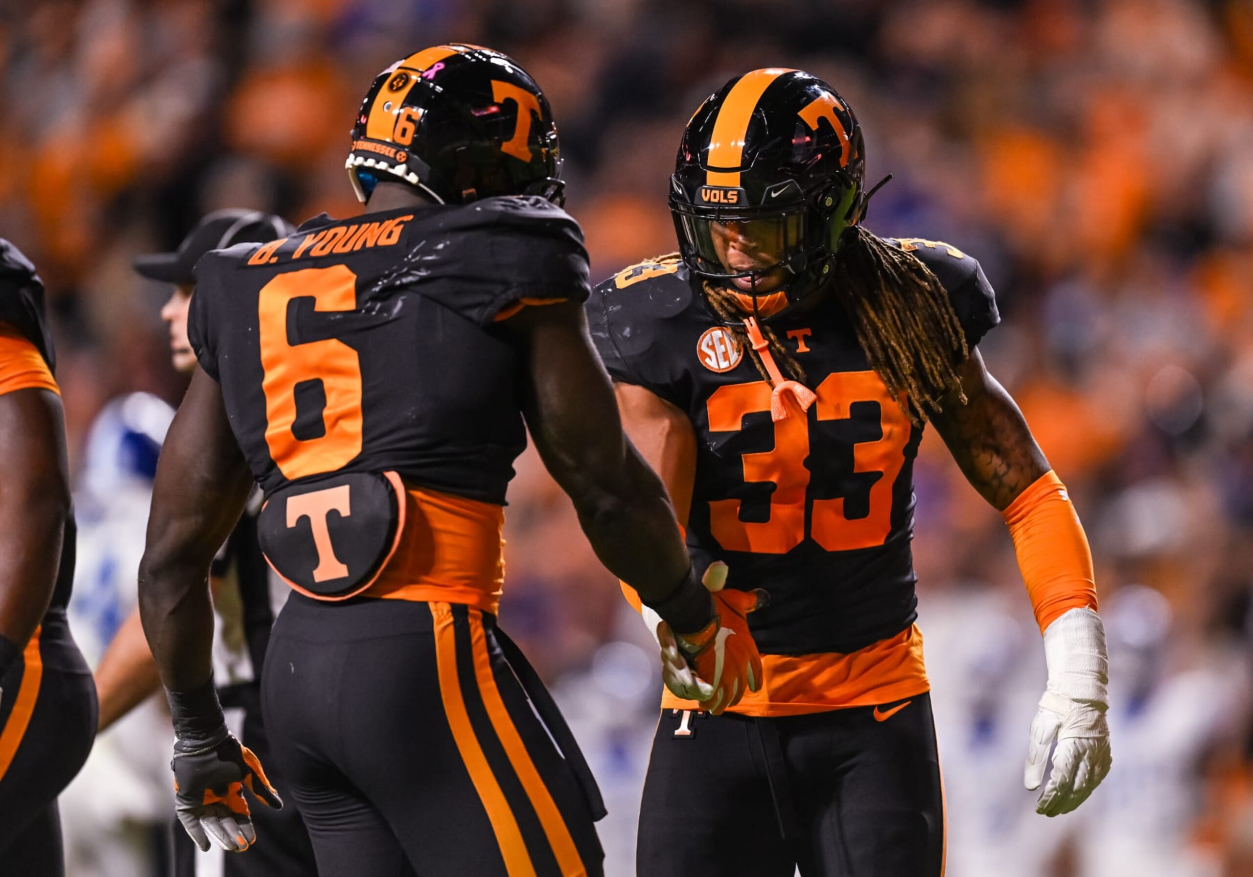 KNOXVILLE, TN - OCTOBER 29:  Tennessee Volunteers linebacker Jeremy Banks (33) celebrates with Tennessee Volunteers defensive lineman Byron Young (6) during the college football game between the Tennessee Volunteers and Kentucky Wildcats October 29, 2022, at Neyland Stadium, in Knoxville, TN. (Photo by Bryan Lynn/Icon Sportswire via Getty Images)