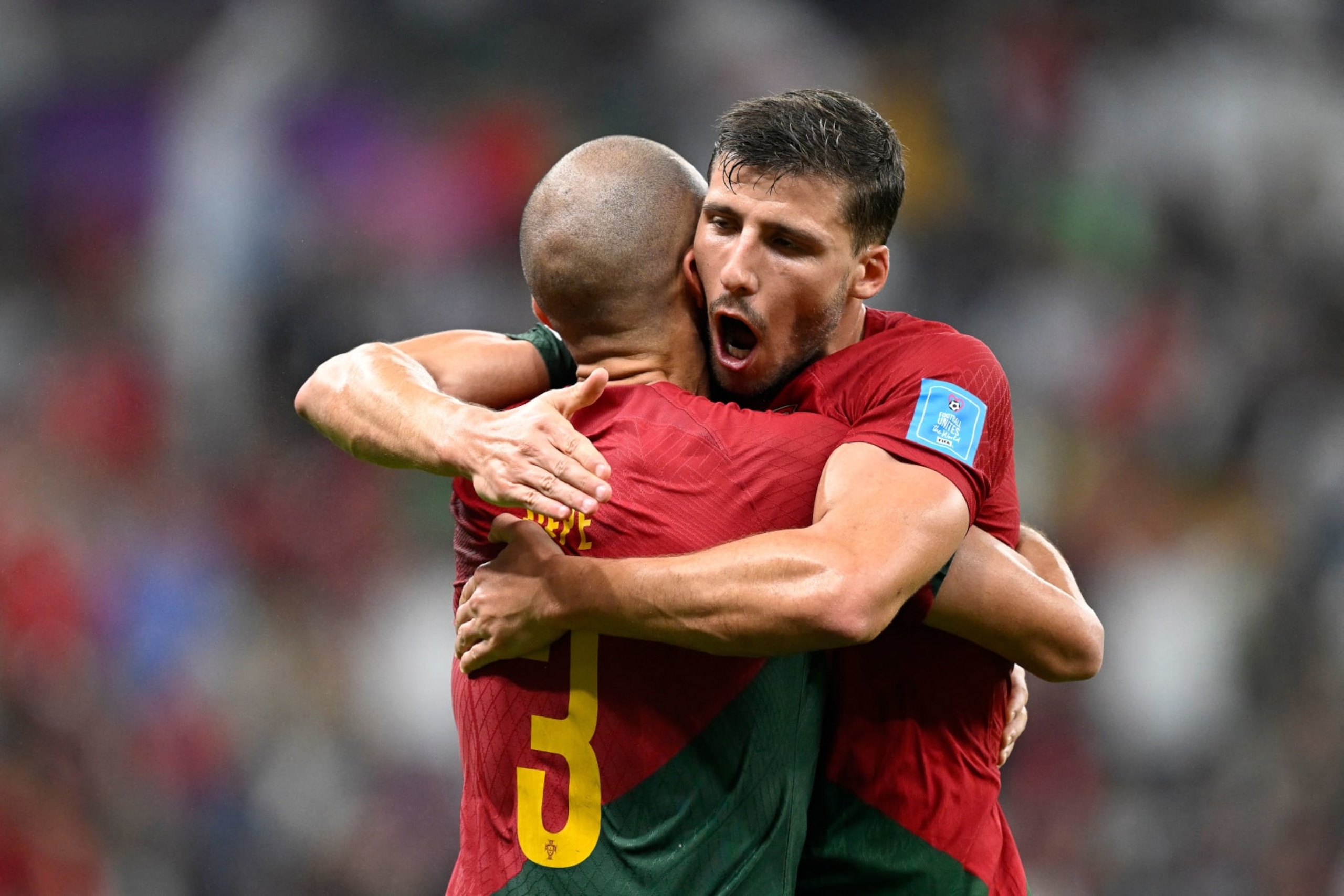 Portugal's defender #03 Pepe (L) celebrates with Portugal's defender #04 Ruben Dias after he scored his team's second goal during the Qatar 2022 World Cup round of 16 football match between Portugal and Switzerland at Lusail Stadium in Lusail, north of Doha on December 6, 2022. (Photo by PATRICIA DE MELO MOREIRA / AFP) (Photo by PATRICIA DE MELO MOREIRA/AFP via Getty Images)