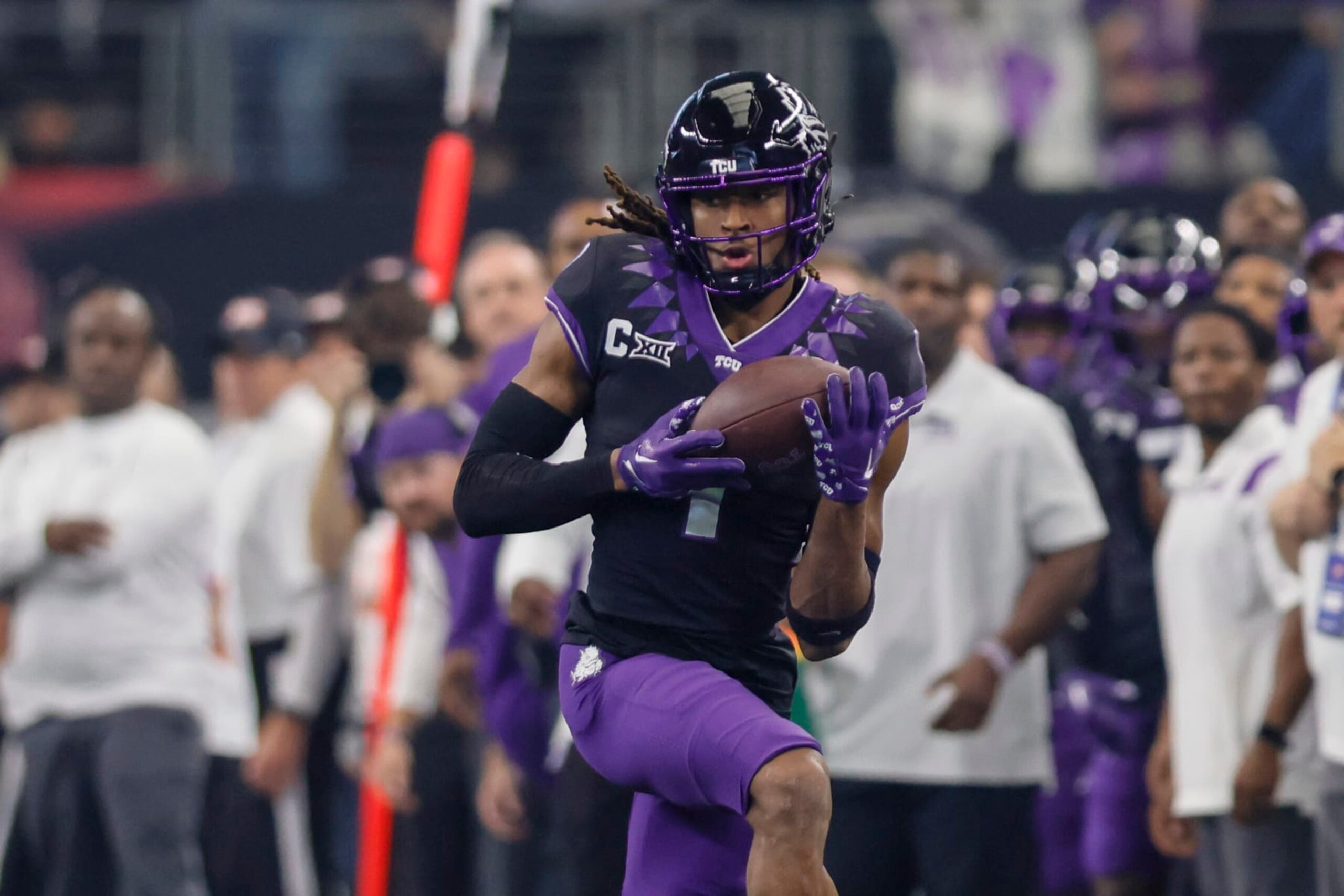 ARLINGTON, TX - DECEMBER 03: TCU Horned Frogs wide receiver Quentin Johnston (1) catches a pass for a first down during the game between the TCU Horned Frogs and the Kansas State Wildcats on December 3, 2022 at AT&T Stadium in Arlington, Texas. (Photo by Matthew Pearce/Icon Sportswire via Getty Images)