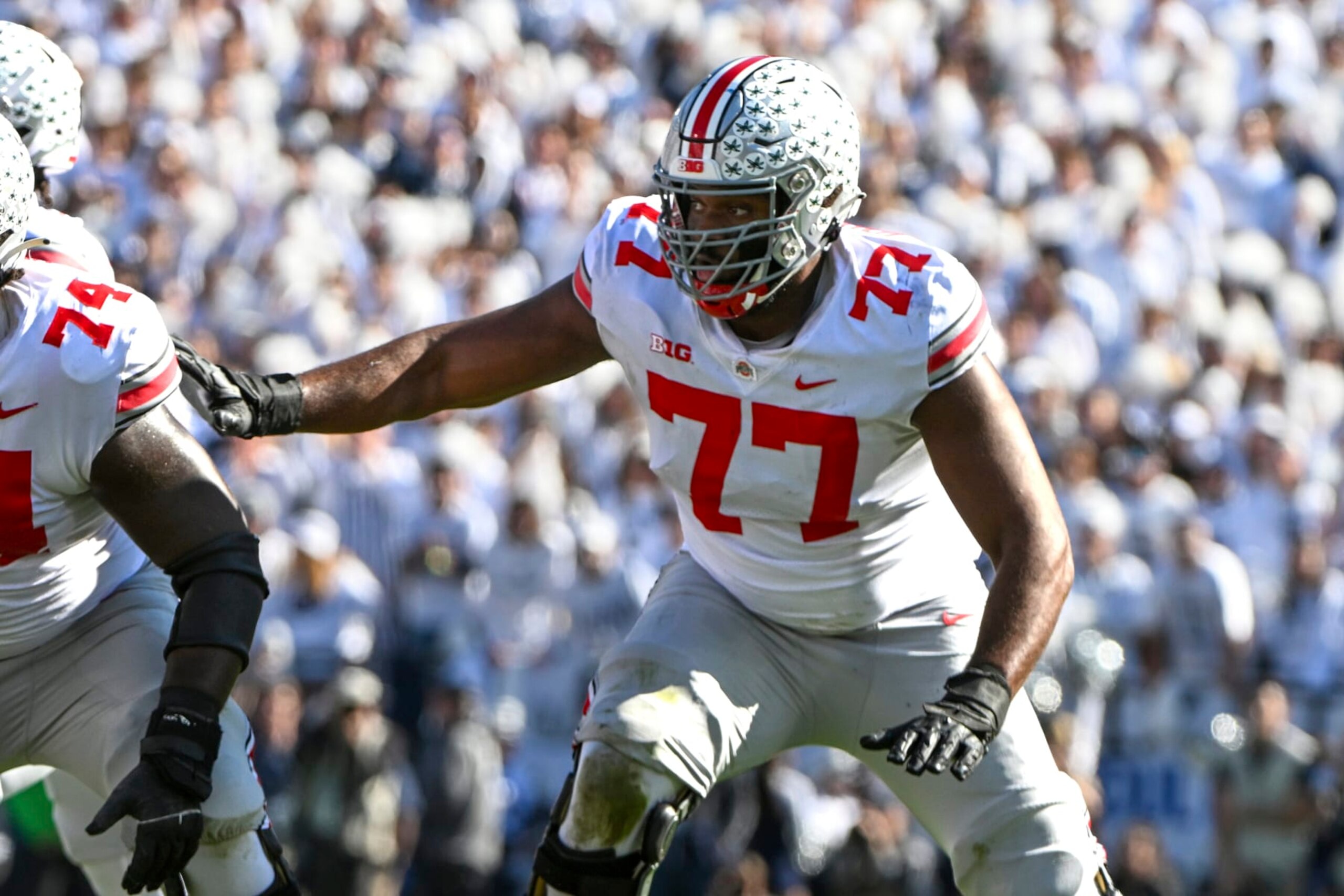 Ohio State offensive lineman Paris Johnson Jr. (77) looks for someone to block against Penn State during an NCAA college football game, Saturday, Oct. 29, 2022, in State College, Pa. (AP Photo/Barry Reeger)