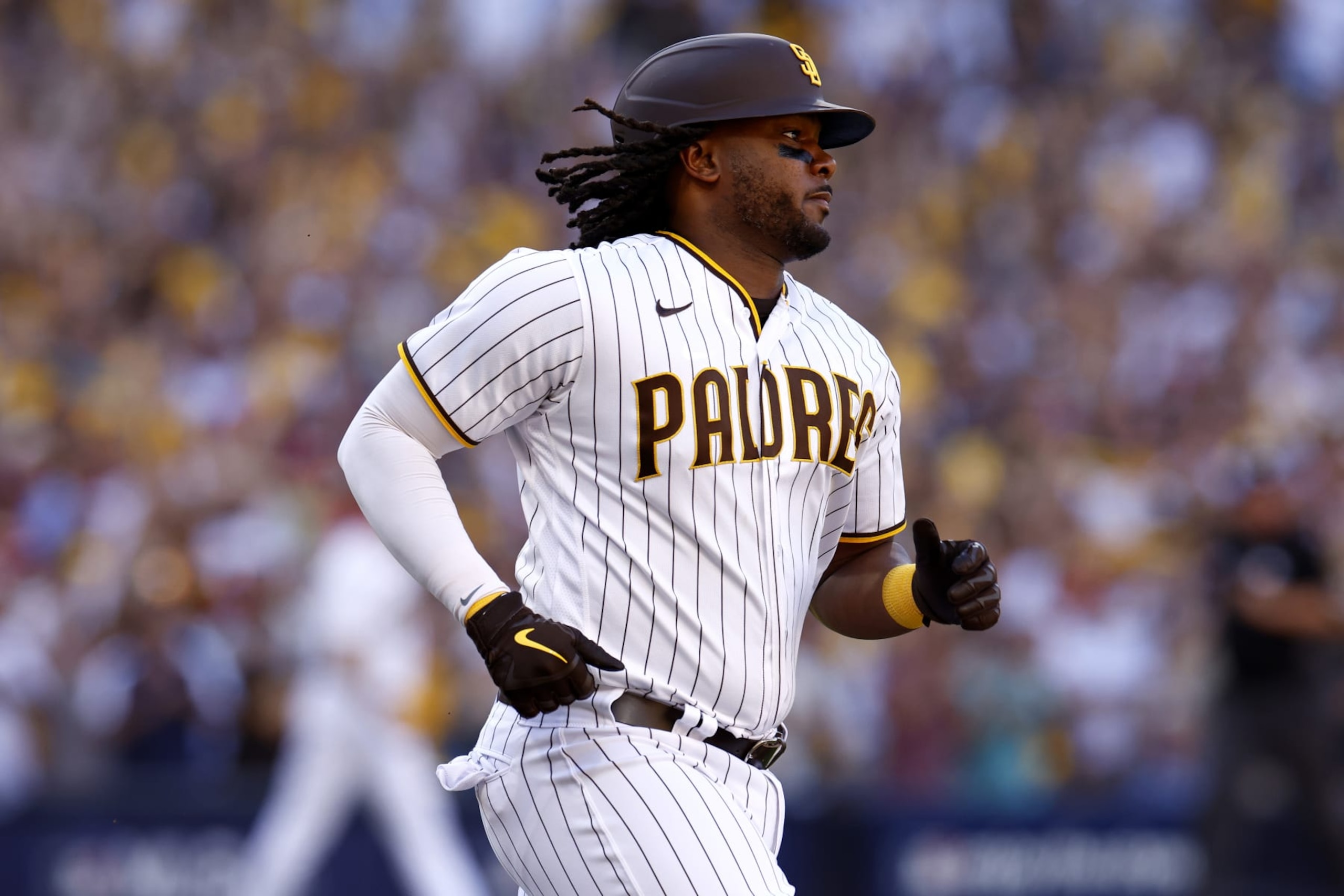 SAN DIEGO, CALIFORNIA - OCTOBER 19: Josh Bell #24 of the San Diego Padres runs to first after hitting an RBI single against the Philadelphia Phillies during the fifth inning in game two of the National League Championship Series at PETCO Park on October 19, 2022 in San Diego, California. (Photo by Ronald Martinez/Getty Images)