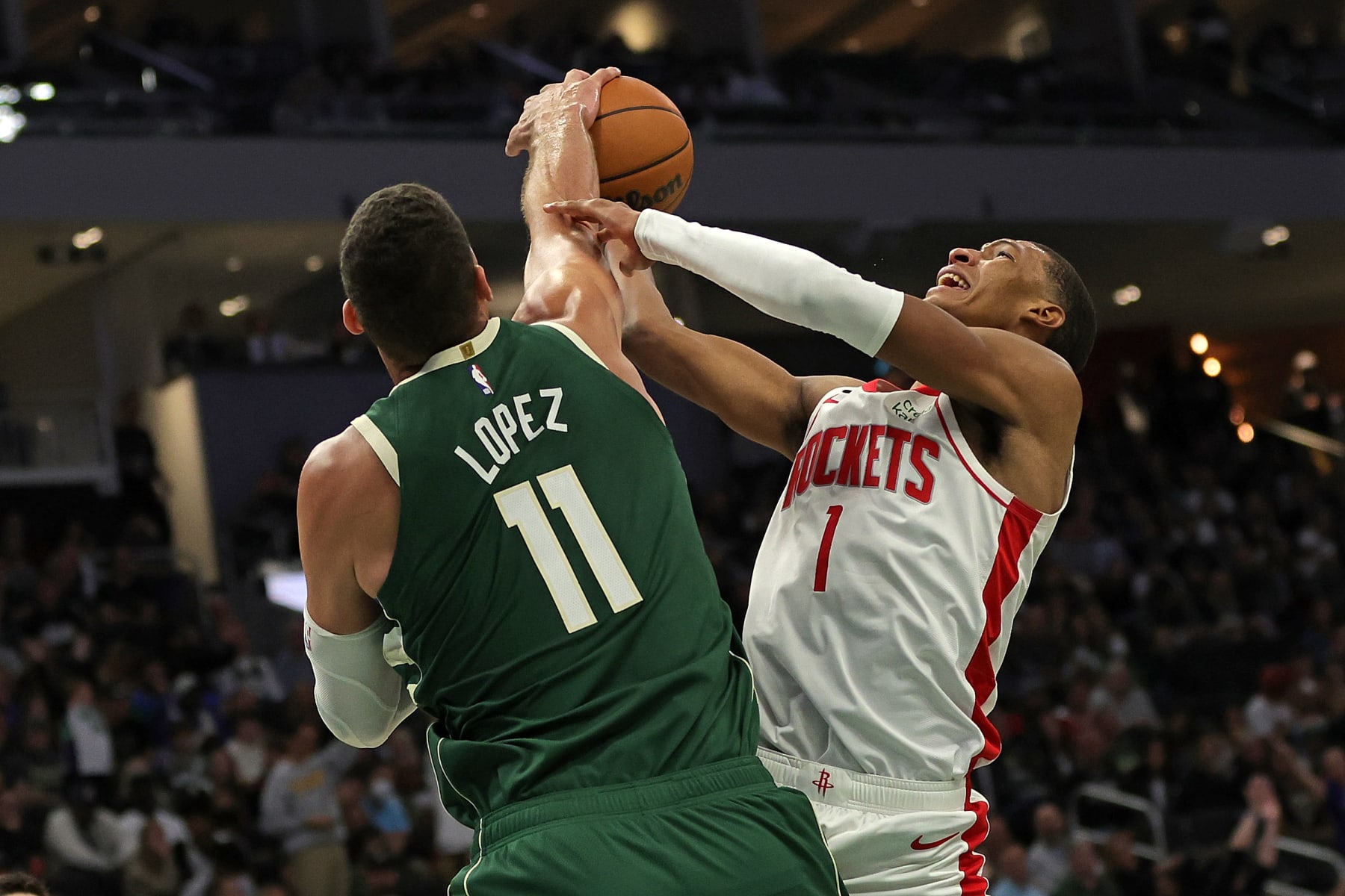 MILWAUKEE, WISCONSIN - OCTOBER 22: Brook Lopez #11 of the Milwaukee Bucks blocks a shot by Jabari Smith Jr. #1 of the Houston Rockets during the second half of a game at Fiserv Forum on October 22, 2022 in Milwaukee, Wisconsin. NOTE TO USER: User expressly acknowledges and agrees that, by downloading and or using this photograph, User is consenting to the terms and conditions of the Getty Images License Agreement. (Photo by Stacy Revere/Getty Images)