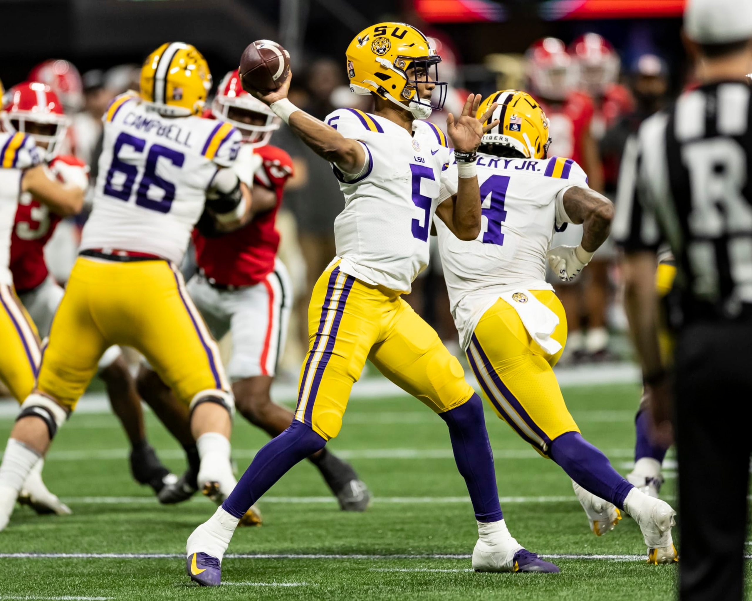 ATLANTA, GA - DECEMBER 3: Jayden Daniels #5 of the LSU Tigers passes the ball during a game between LSU Tigers and Georgia Bulldogs at Mercedes-Benz Stadium on December 3, 2022 in Atlanta, Georgia. (Photo by Steve Limentani/ISI Photos/Getty Images)