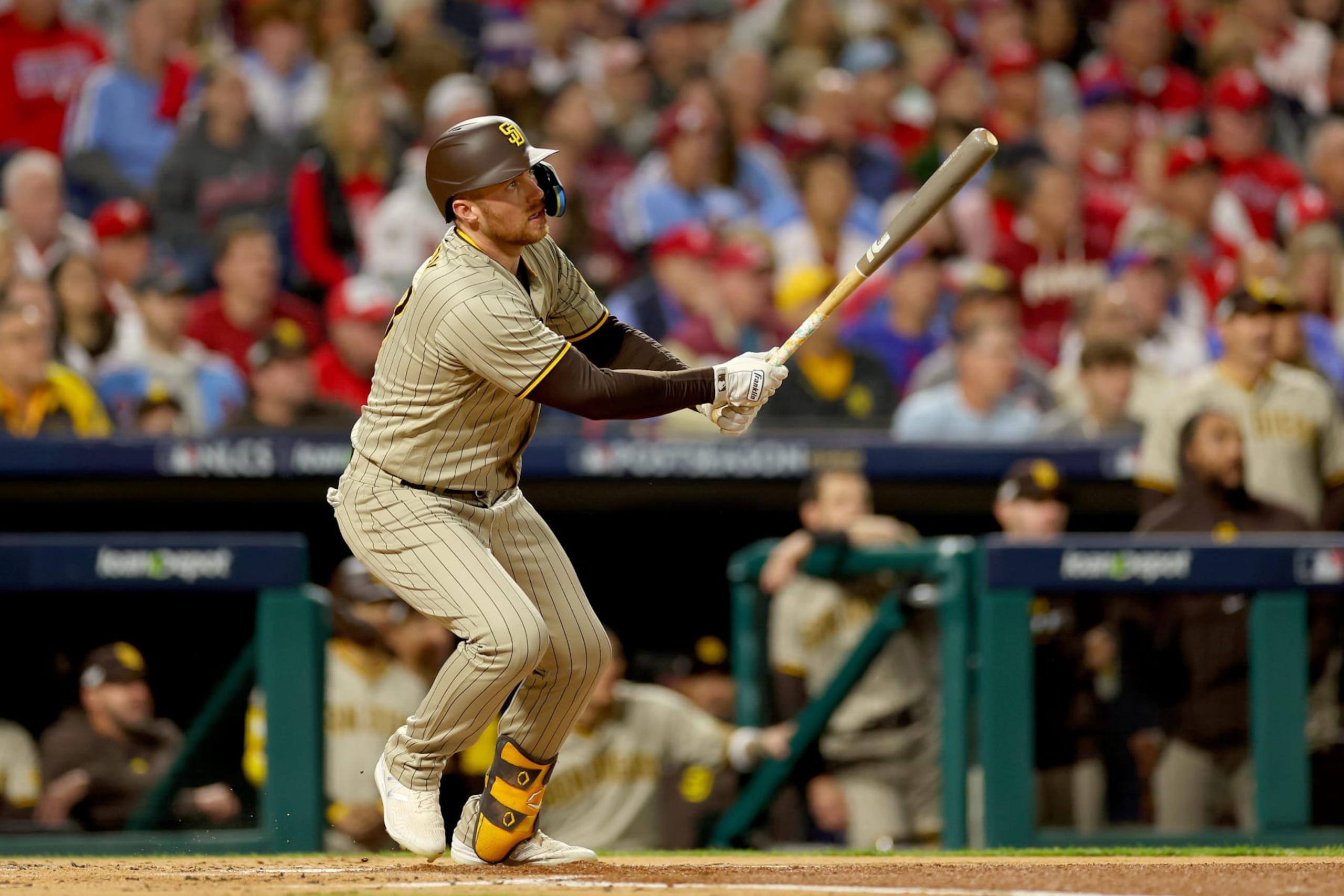 PHILADELPHIA, PENNSYLVANIA - OCTOBER 22: Brandon Drury #17 of the San Diego Padres hits a two-run RBI double during the first inning against the Philadelphia Phillies in game four of the National League Championship Series at Citizens Bank Park on October 22, 2022 in Philadelphia, Pennsylvania. (Photo by Mike Ehrmann/Getty Images)