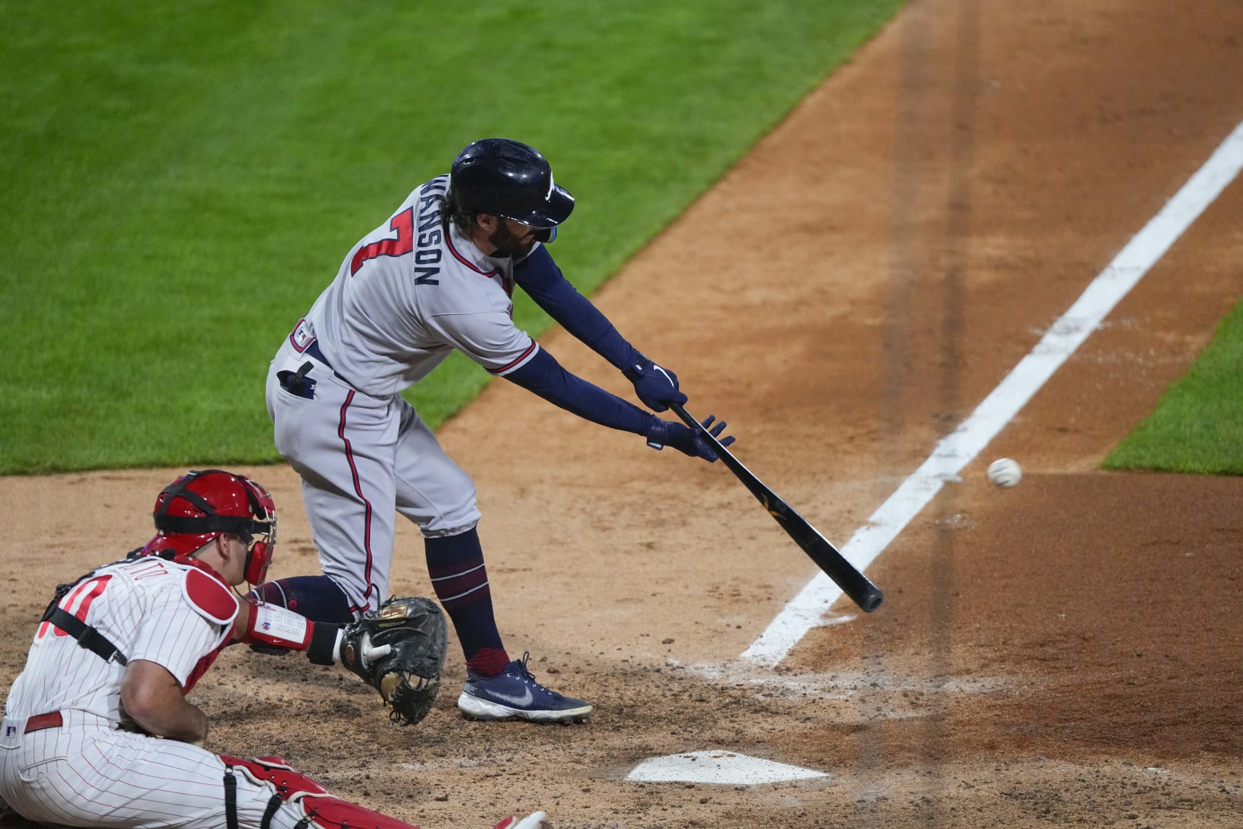 PHILADELPHIA, PA - OCTOBER 14:  Atlanta Braves Shortstop Dansby Swanson (7) hits a double during the sixth inning of Game 3 of the NLDS between the Atlanta Braves and the Philadelphia Phillies on October 14, 2022, at Citizens Bank Park in Philadelphia, PA. (Photo by Gregory Fisher/Icon Sportswire via Getty Images)