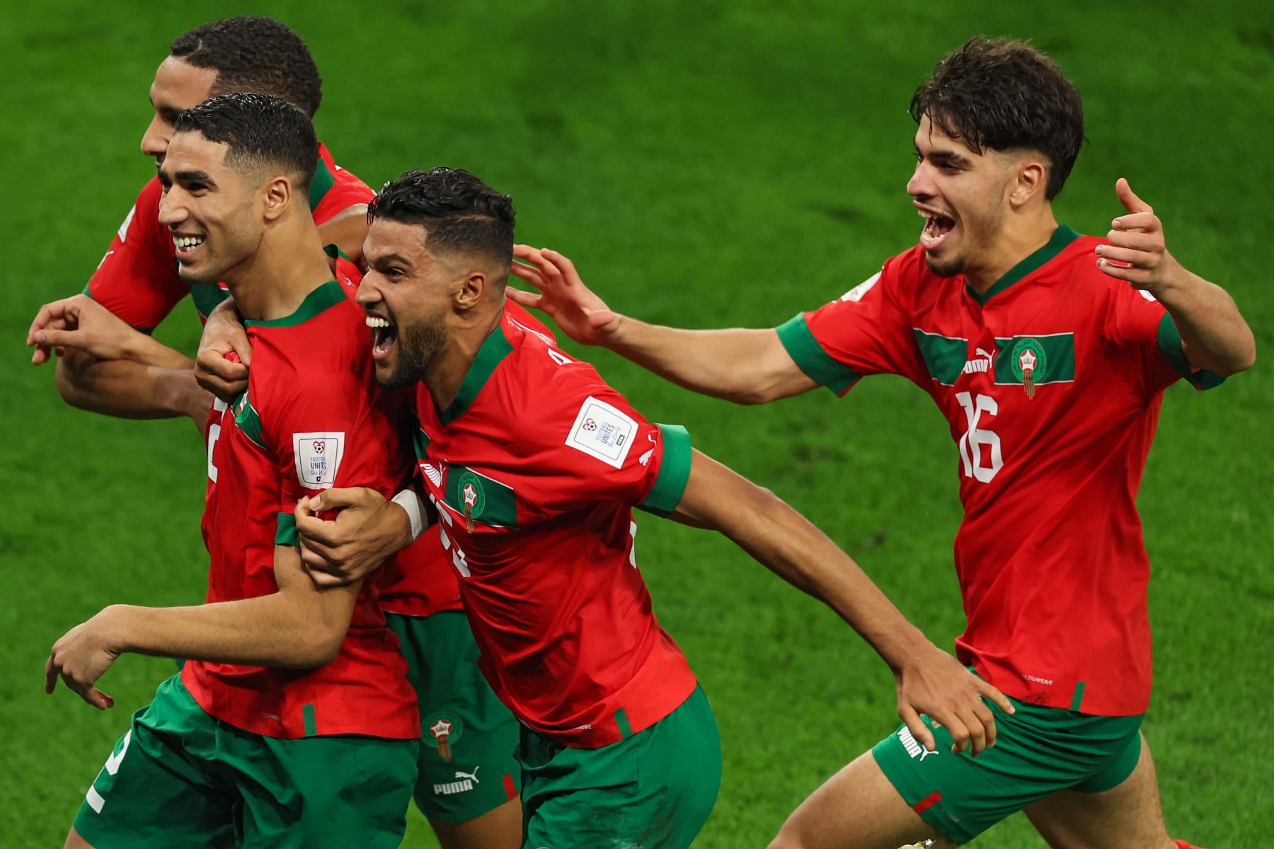 AL RAYYAN, QATAR - DECEMBER 06: Achraf Hakimi of Morocco and teammates celebrate after their win in the penalty shoot out during the FIFA World Cup Qatar 2022 Round of 16 match between Morocco and Spain at Education City Stadium on December 06, 2022 in Al Rayyan, Qatar. (Photo by Patrick Smith - FIFA/FIFA via Getty Images)