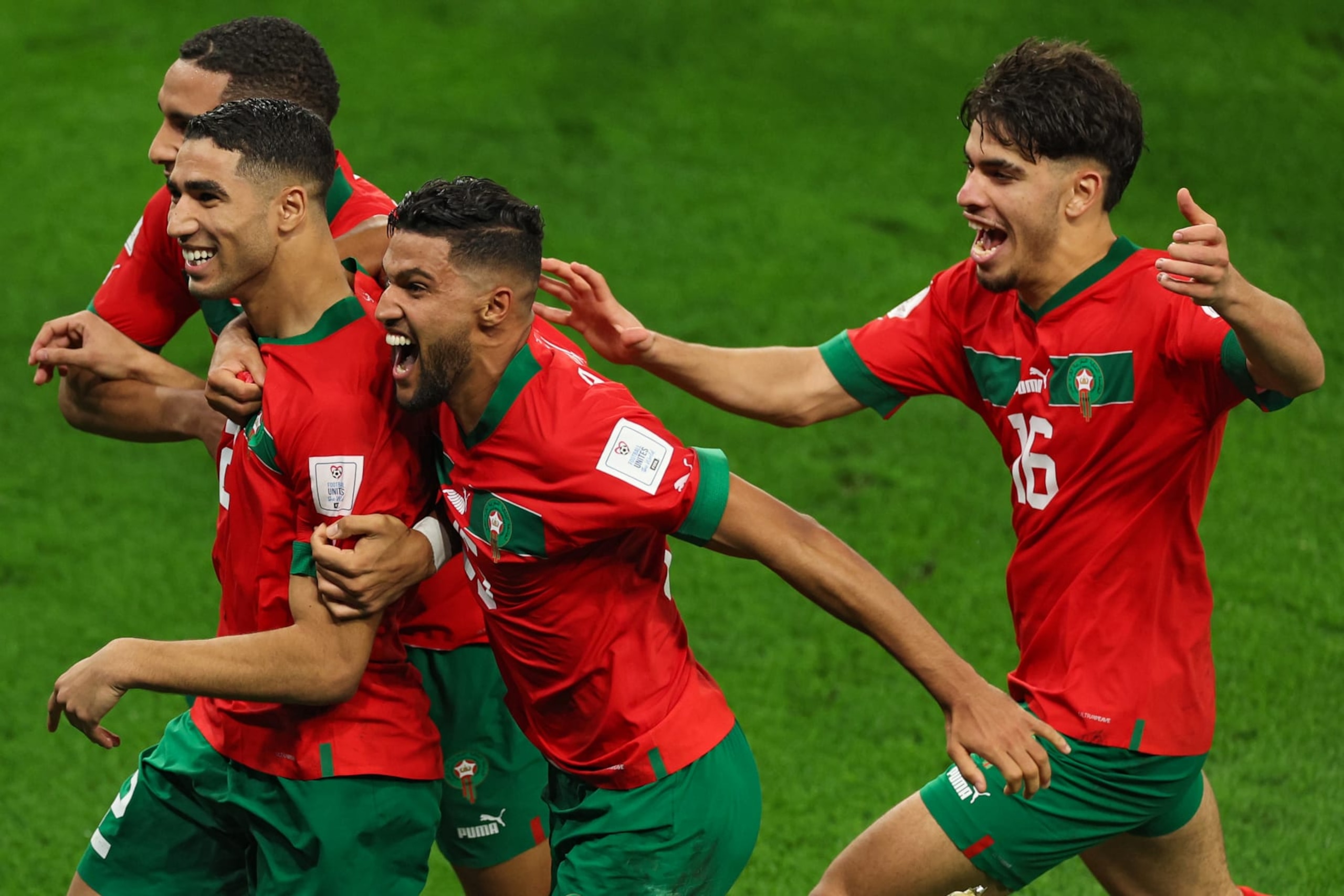 AL RAYYAN, QATAR - DECEMBER 06: Achraf Hakimi of Morocco and teammates celebrate after their win in the penalty shoot out during the FIFA World Cup Qatar 2022 Round of 16 match between Morocco and Spain at Education City Stadium on December 06, 2022 in Al Rayyan, Qatar. (Photo by Patrick Smith - FIFA/FIFA via Getty Images)