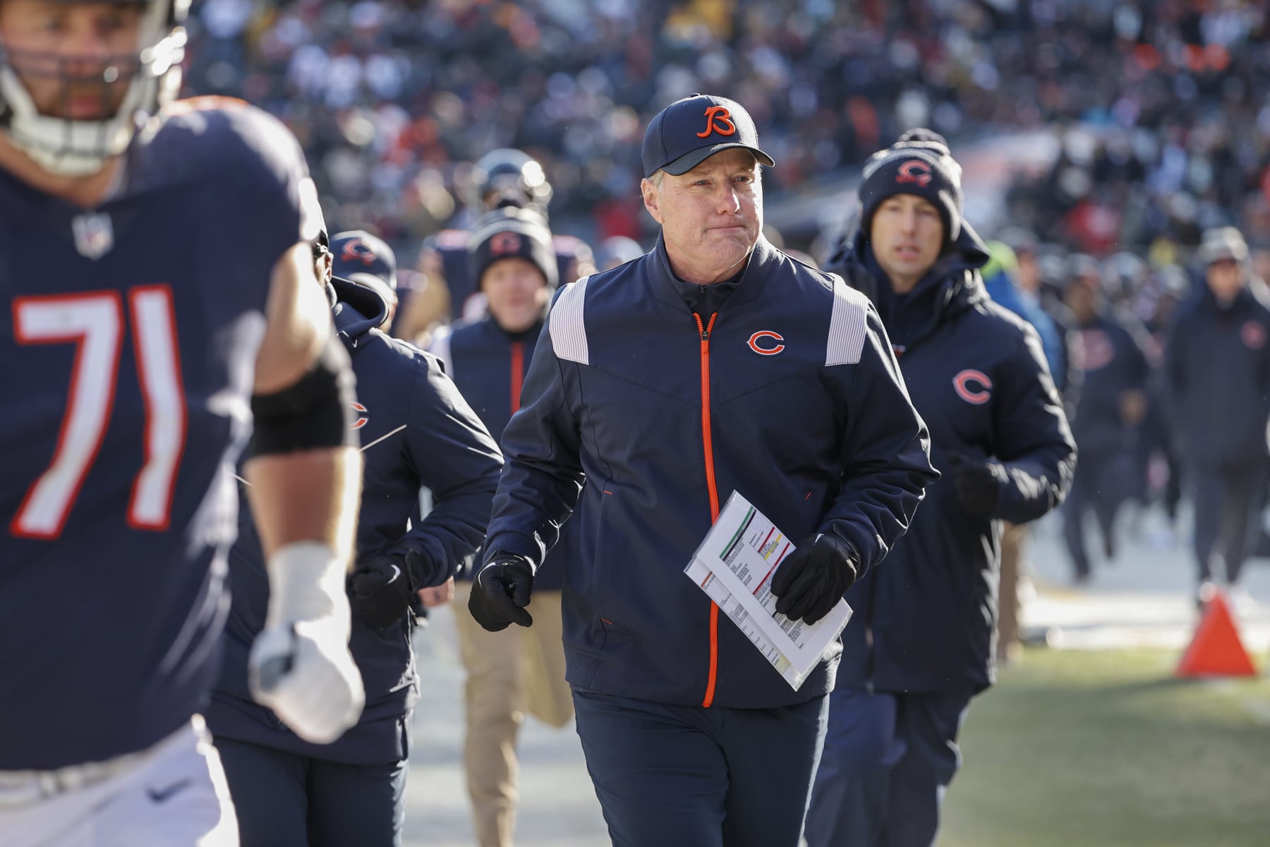 Chicago Bears head coach Matt Eberflus runs back to the locker room after the first half of an NFL football game against the Green Bay Packers, Sunday, Dec. 4, 2022, in Chicago. (AP Photo/Kamil Krzaczynski)
