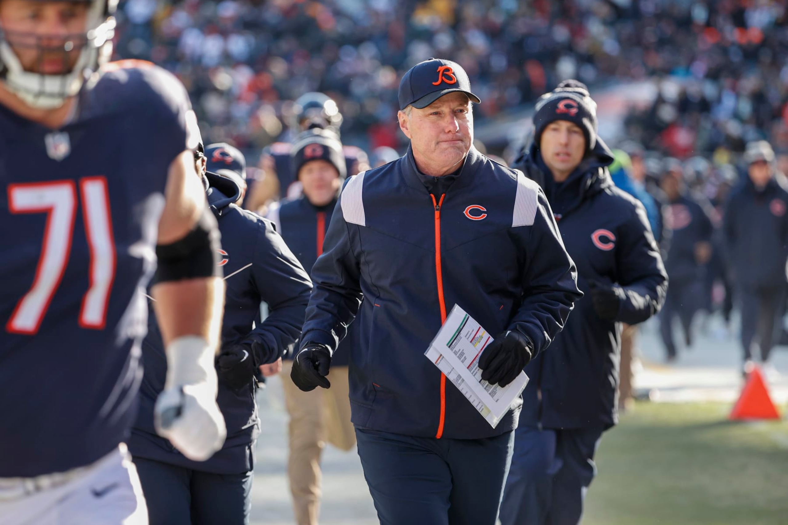 Chicago Bears head coach Matt Eberflus runs back to the locker room after the first half of an NFL football game against the Green Bay Packers, Sunday, Dec. 4, 2022, in Chicago. (AP Photo/Kamil Krzaczynski)